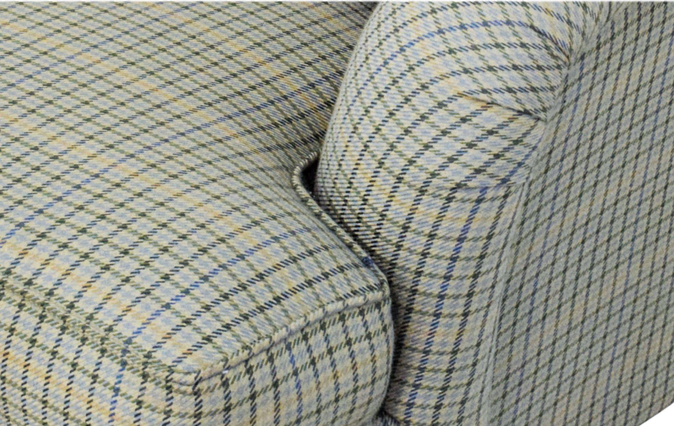 Ralph Lauren English rolled-arm three-seat Wyland sofa, 2004, Down-filled, mahogany base, brass casters. MSRP of 11,200 USD.