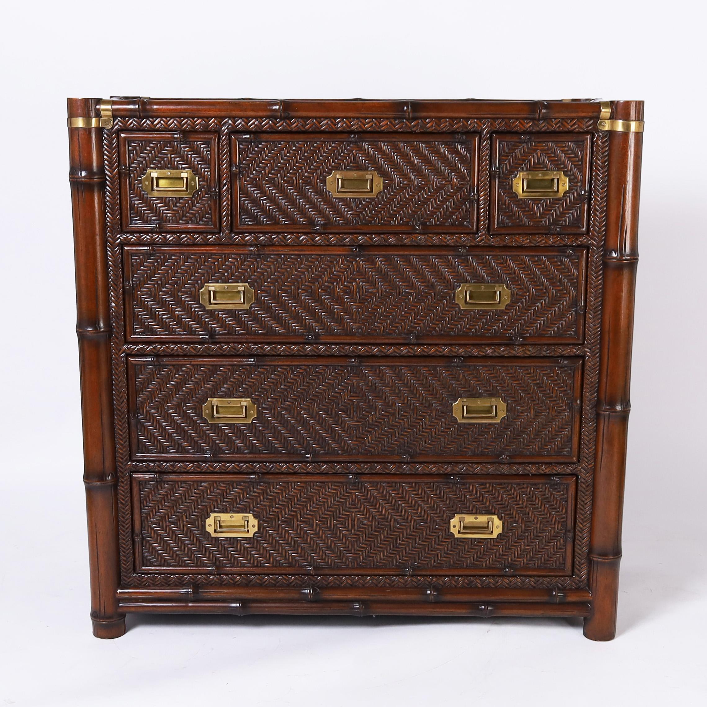 Handsome vintage British colonial style chest crafted with mahogany faux bamboo as a frame and around the drawers and having herringbone grasscloth panels all around with campaign brass hardware. Signed Polo Ralph Lauren in a drawer.