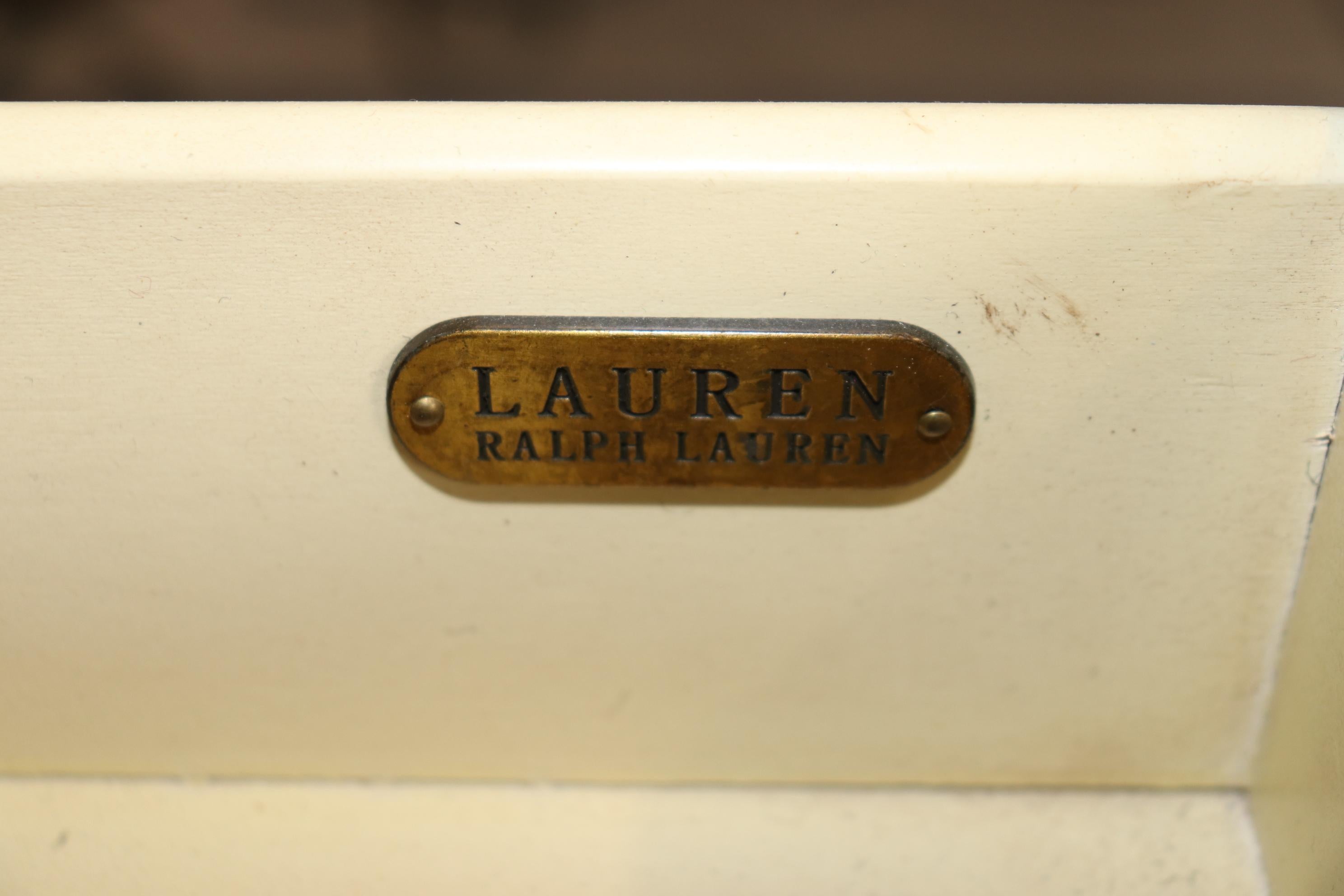 This is an intentionally distressed Ralph Lauren French Directoire style commode or dresser. The commode is in good working condition and is labeled. Measures 46 wide x 18 deep x 34 tall. The commode dates to the 2000s era. 