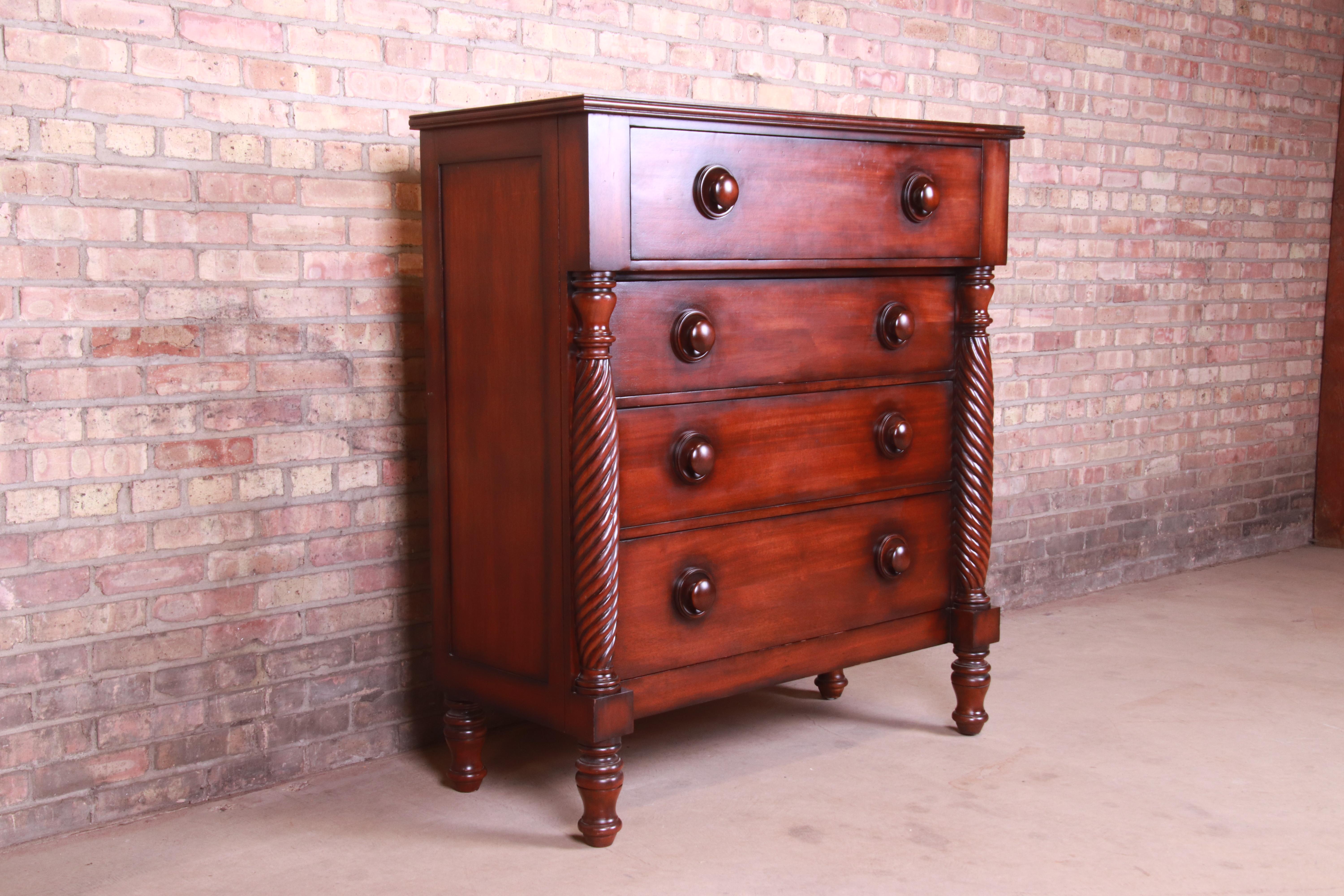 A gorgeous American Empire style four-drawer highboy dresser chest

By Ralph Lauren for Henredon

Colombia, circa 1990s

Mahogany, with carved columns and turned legs.

Measures: 45.88
