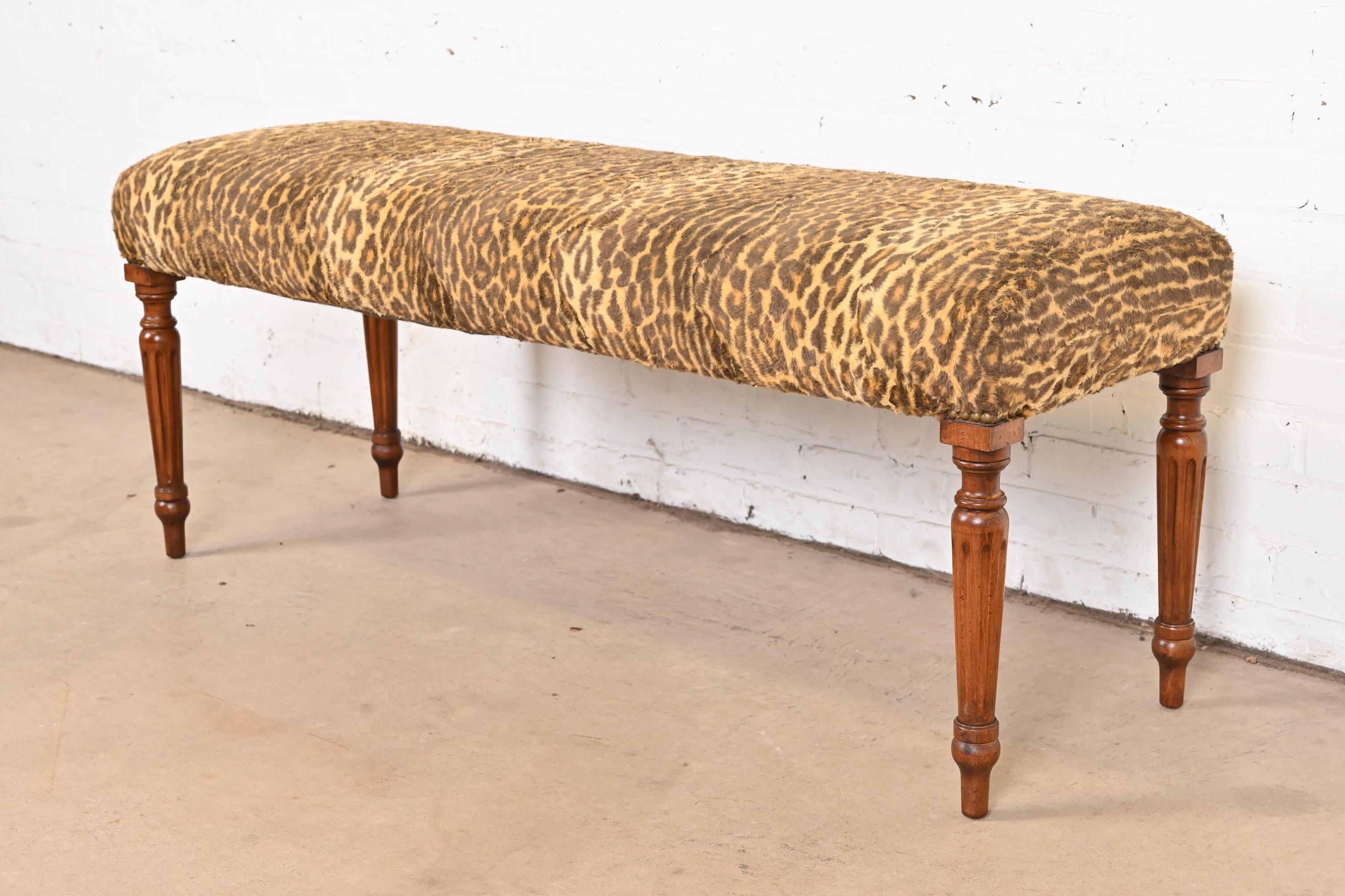 A gorgeous French Regency Louis XVI style window bench or foot-of-bed bench

By Ralph Lauren

USA, Late 20th Century

Carved walnut legs, with leopard print upholstery.

Measures: 49