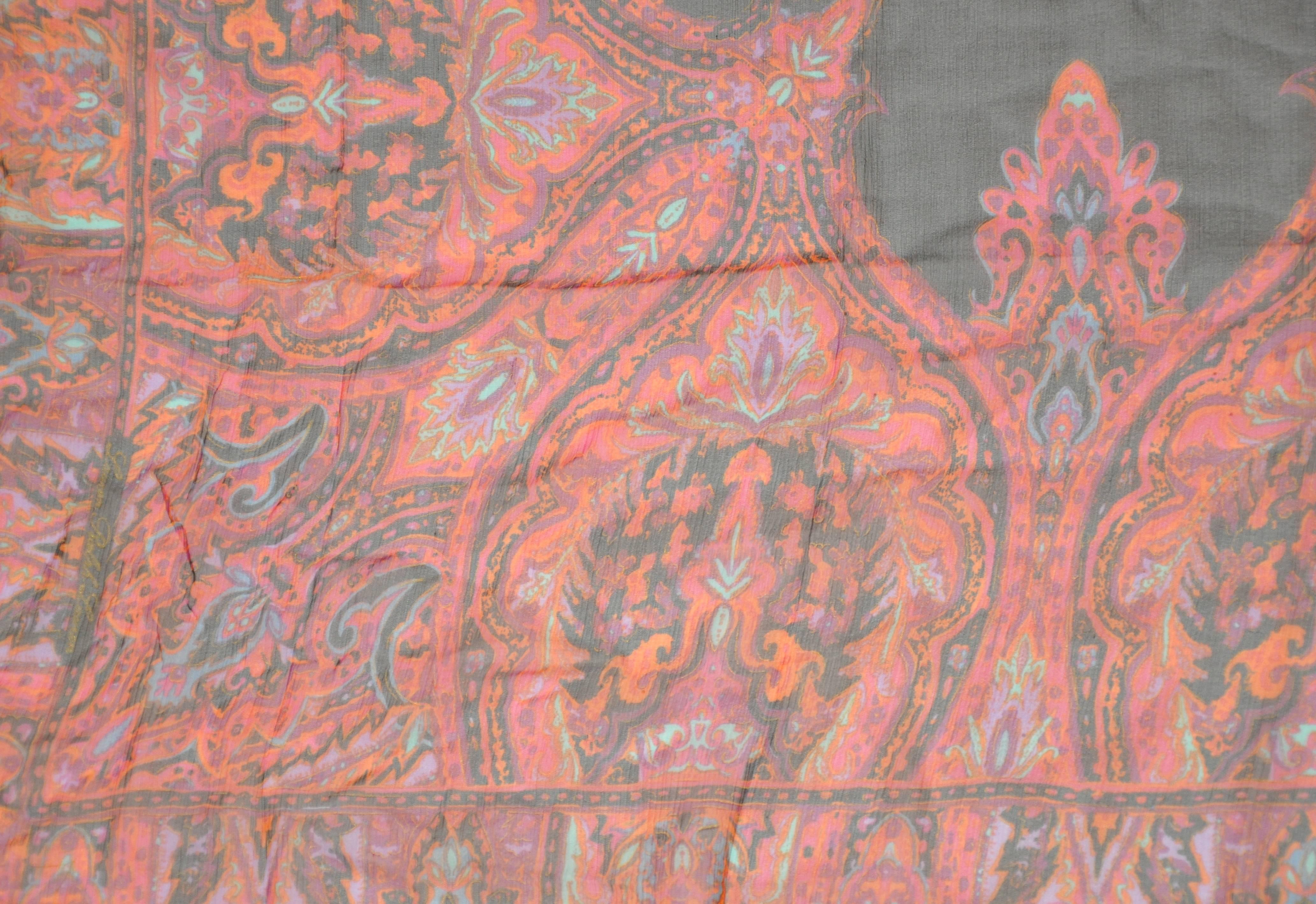        Ralph Lauren multi-colored fringed paisley borders accenting a black center silk chiffon scarf measures 39 inches by 44 inches. Made in Italy.