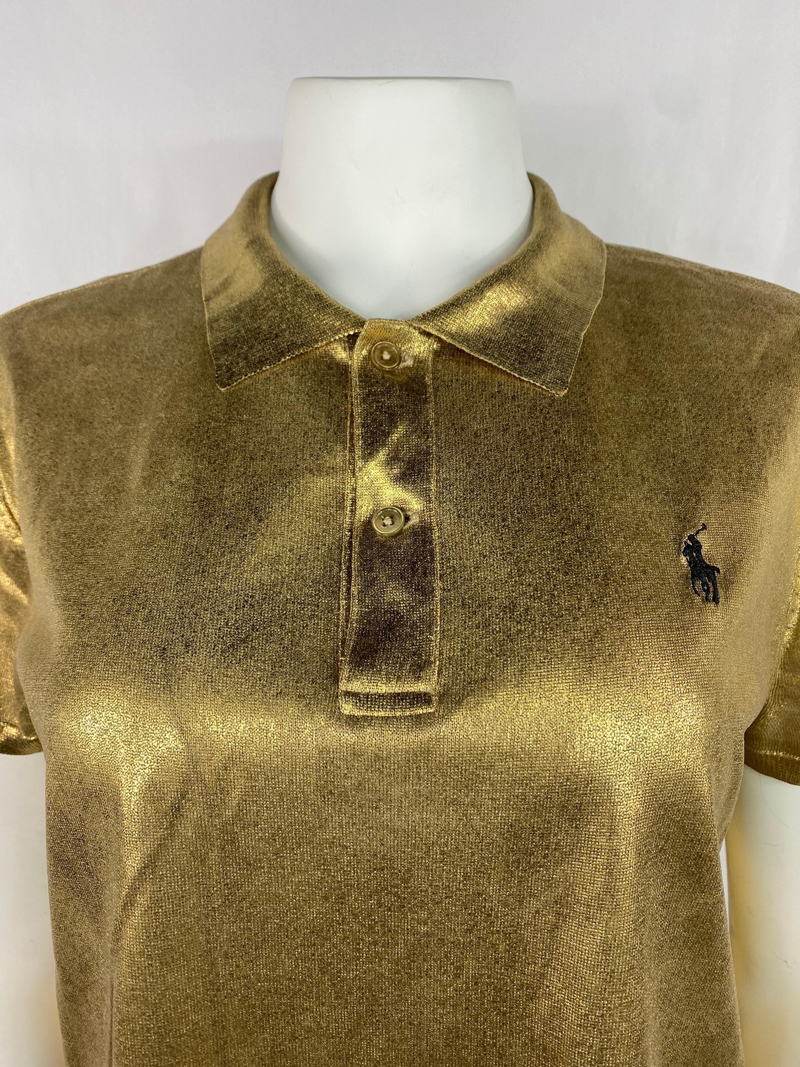 Product details:

The shirt features gold metallic finish with collar, two front button closure and black embroidered polo logo.