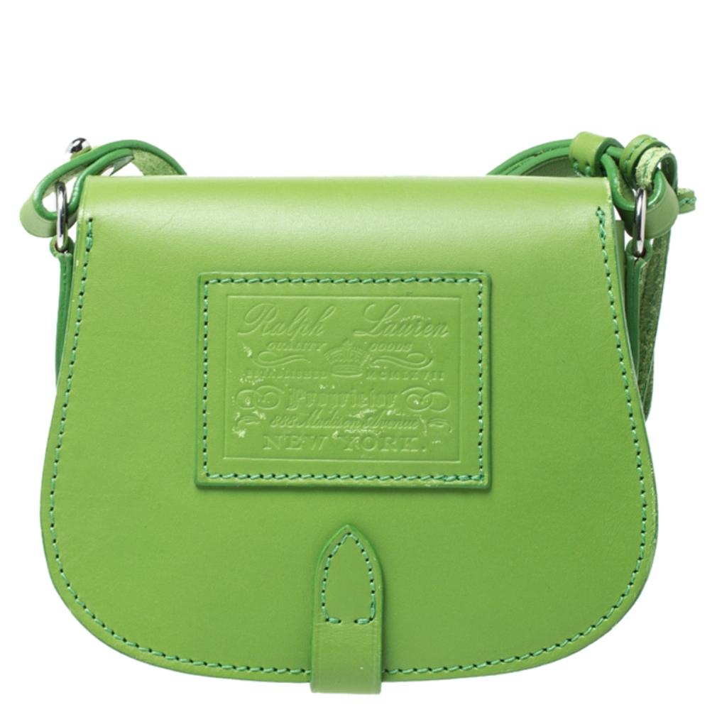 This stunning Saddle bag by Ralph Lauren comes in a lovely shade of green. It has been crafted from quality leather and features a classic silhouette. The bag comes with a front flap that opens to a spacious interior that can house your necessities.