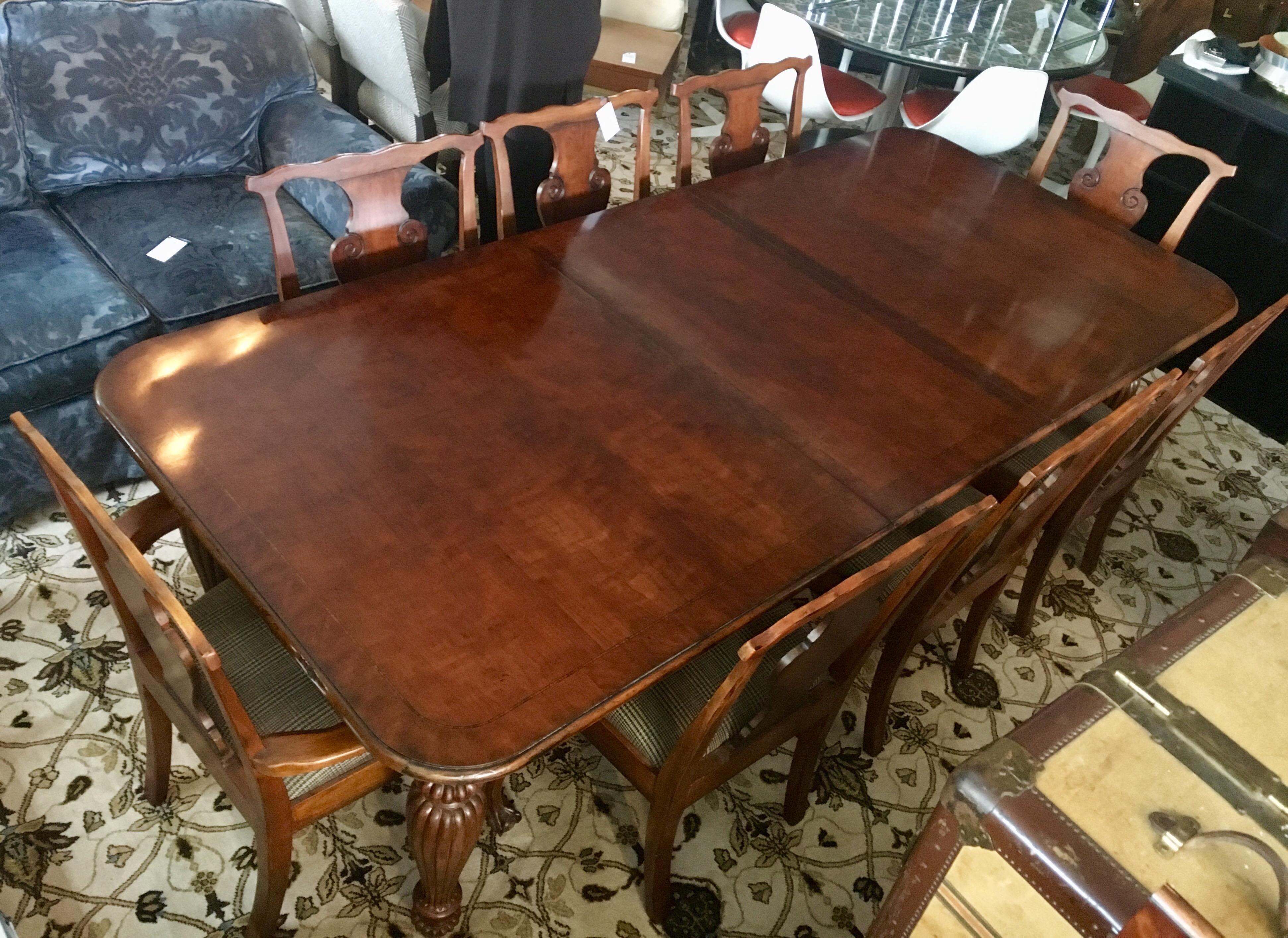 Elegant and sought after Ralph Lauren mahogany dining room table and matching chairs.
The table is expandable with its two twenty two inch leaves. It can go from 79