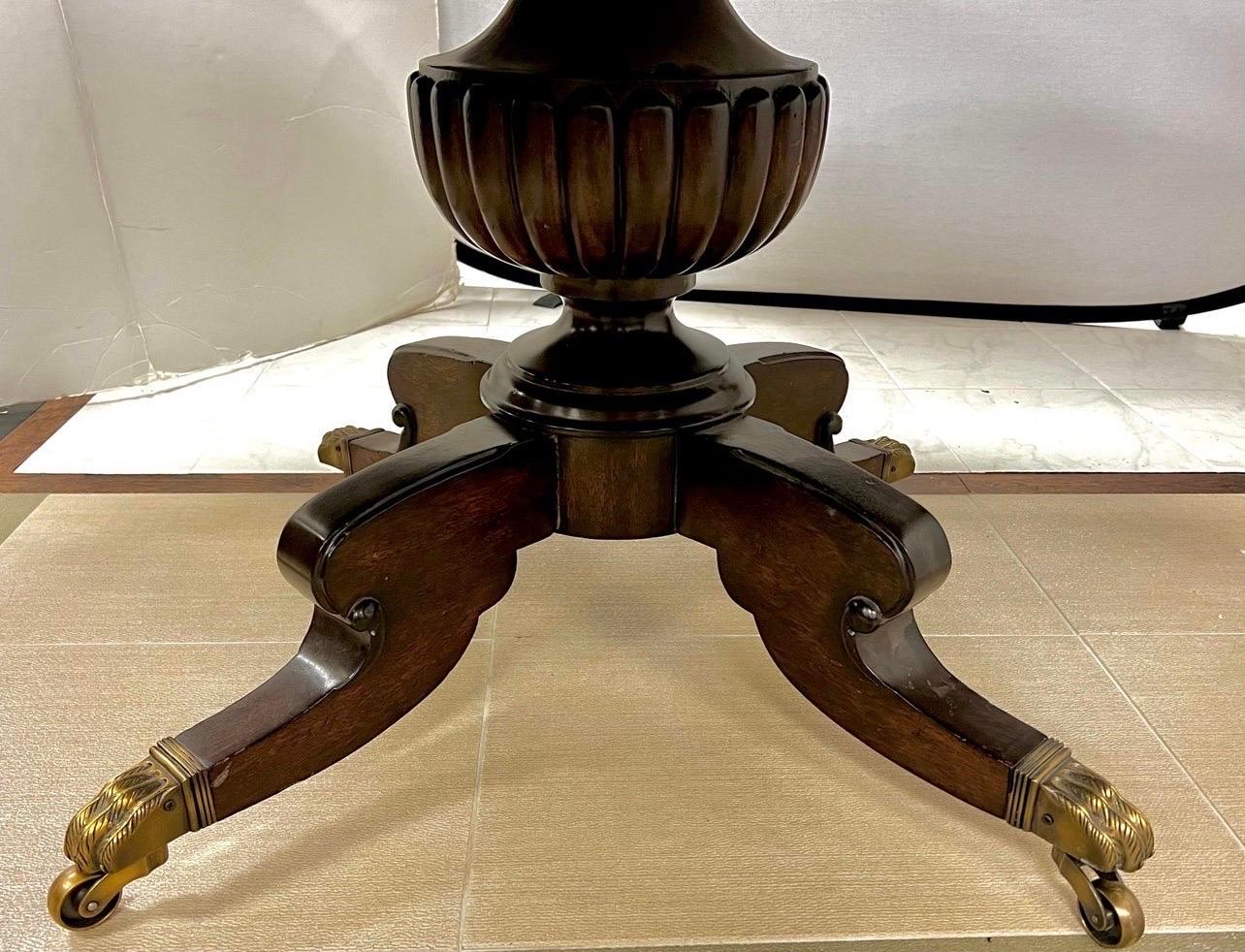 Gorgeous Ralph Lauren/Henredon round wooden dining table with six matching saddle leather chairs with cane backs.  All in great condition.
The table is 60 inches round and there are no leaves so can sit six to eight comfortably.  The pedestal table