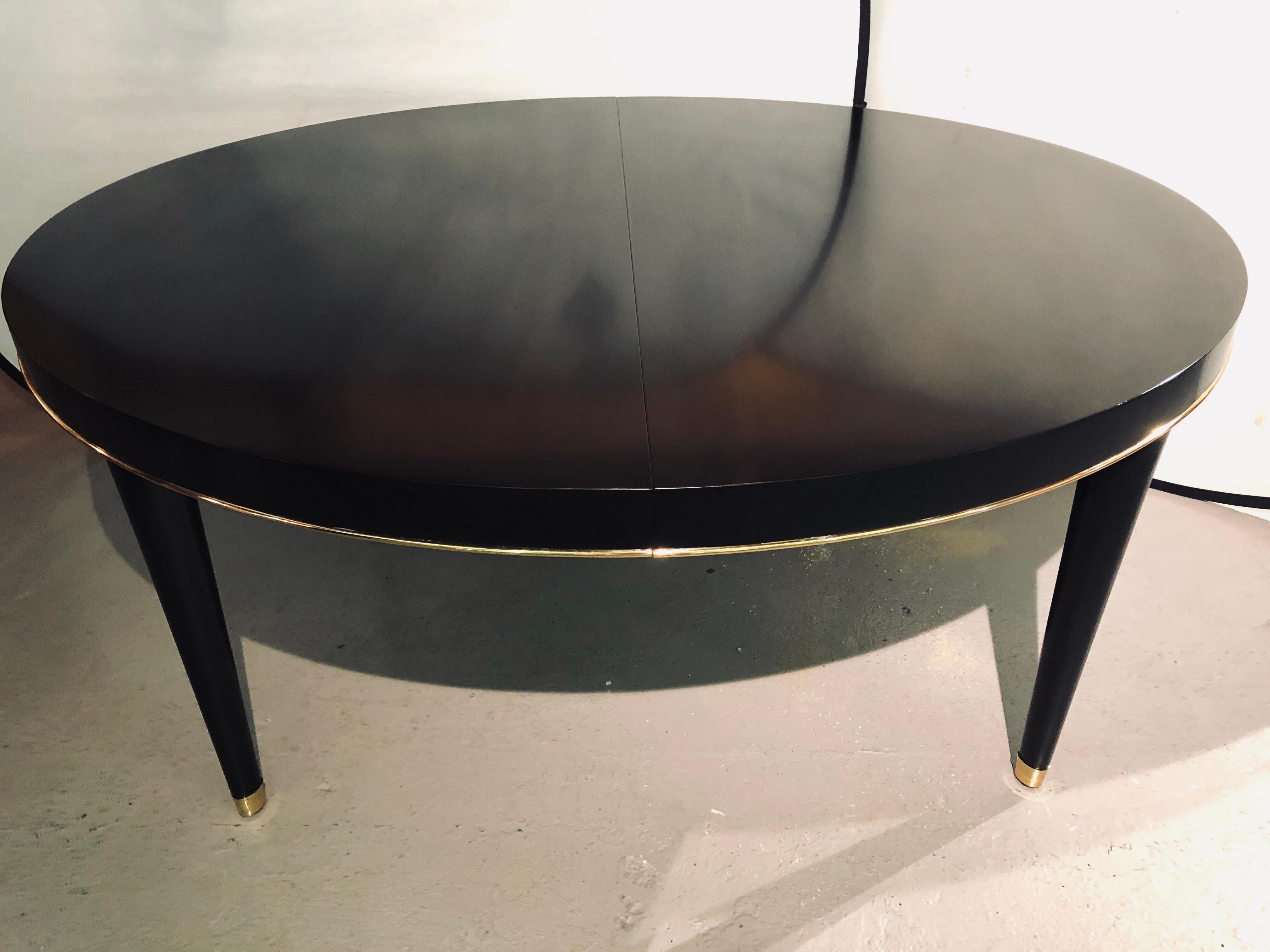 Ralph Lauren ebony brass mounted dining table. 