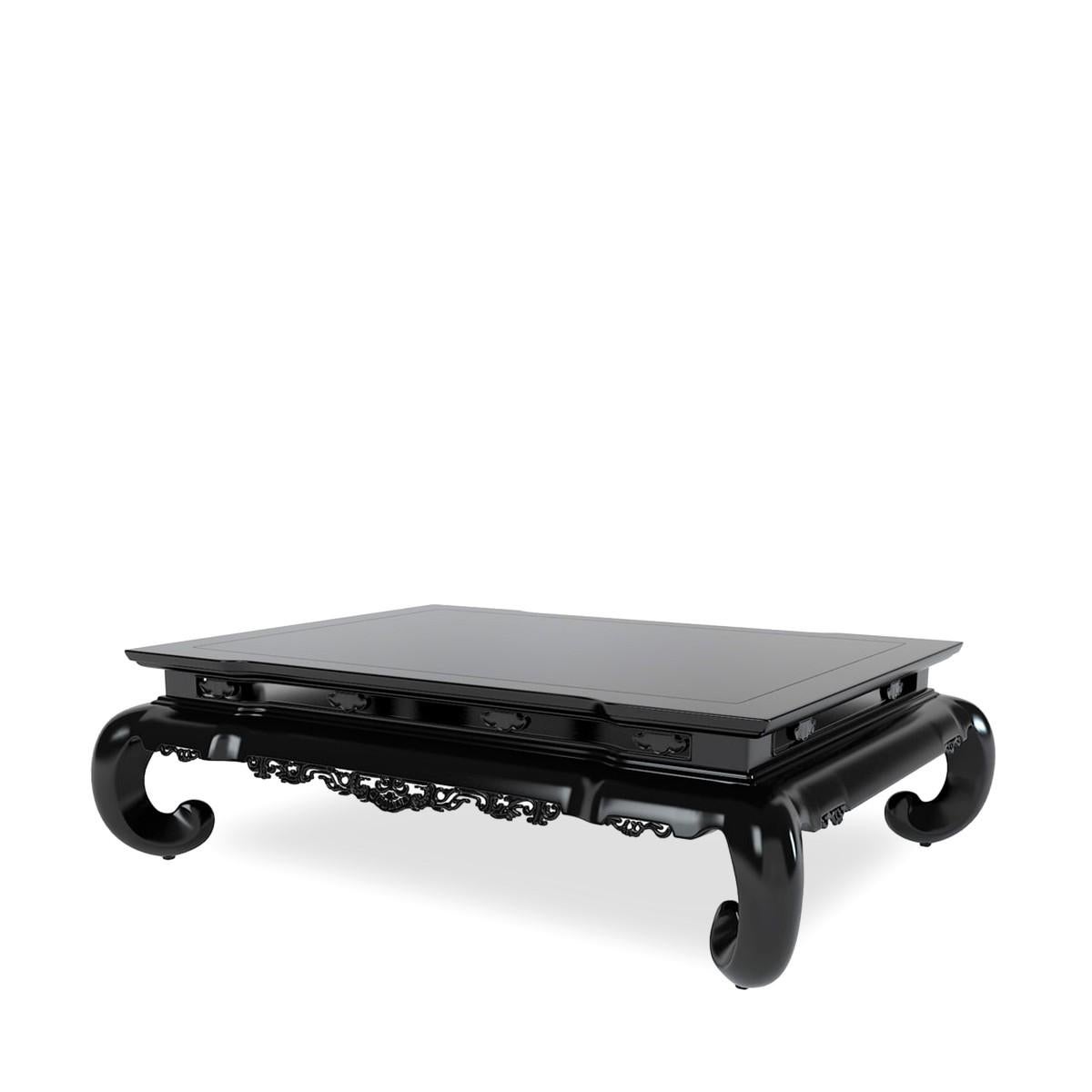 The Beekman cocktail table in black lacquer finish by Ralph Lauren Home collection. Finely crafted of Philippine mahogany solids with Philippine mahogany veneer. Imported, circa 2010. 
Features rectangular top and carved design in the Asian