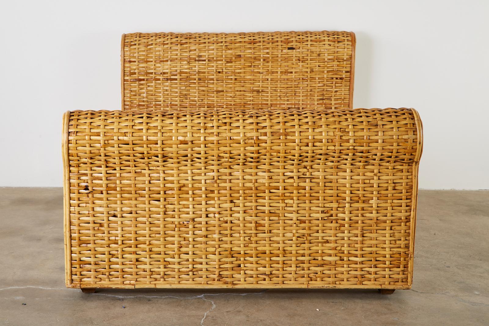 Organic modern style woven bamboo rattan bed by Ralph Lauren Home Polo collection. The bed features a subtle sleigh form on each end of the frame. Very heavy and solid with makers plaque on the headboard. From an estate in Malibu, CA. More than