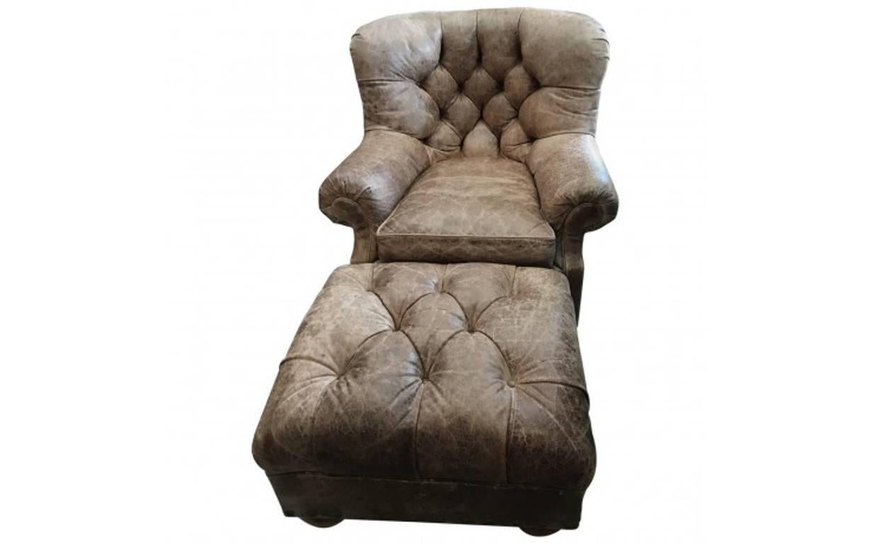 Ralph Lauren’s home furnishings and accessories reflect an enduring American style and the same level of phenomenal craftsmanship synonymous with his clothing. Plush and sophisticated, this shapely writer's chair and ottoman comes clad in distressed