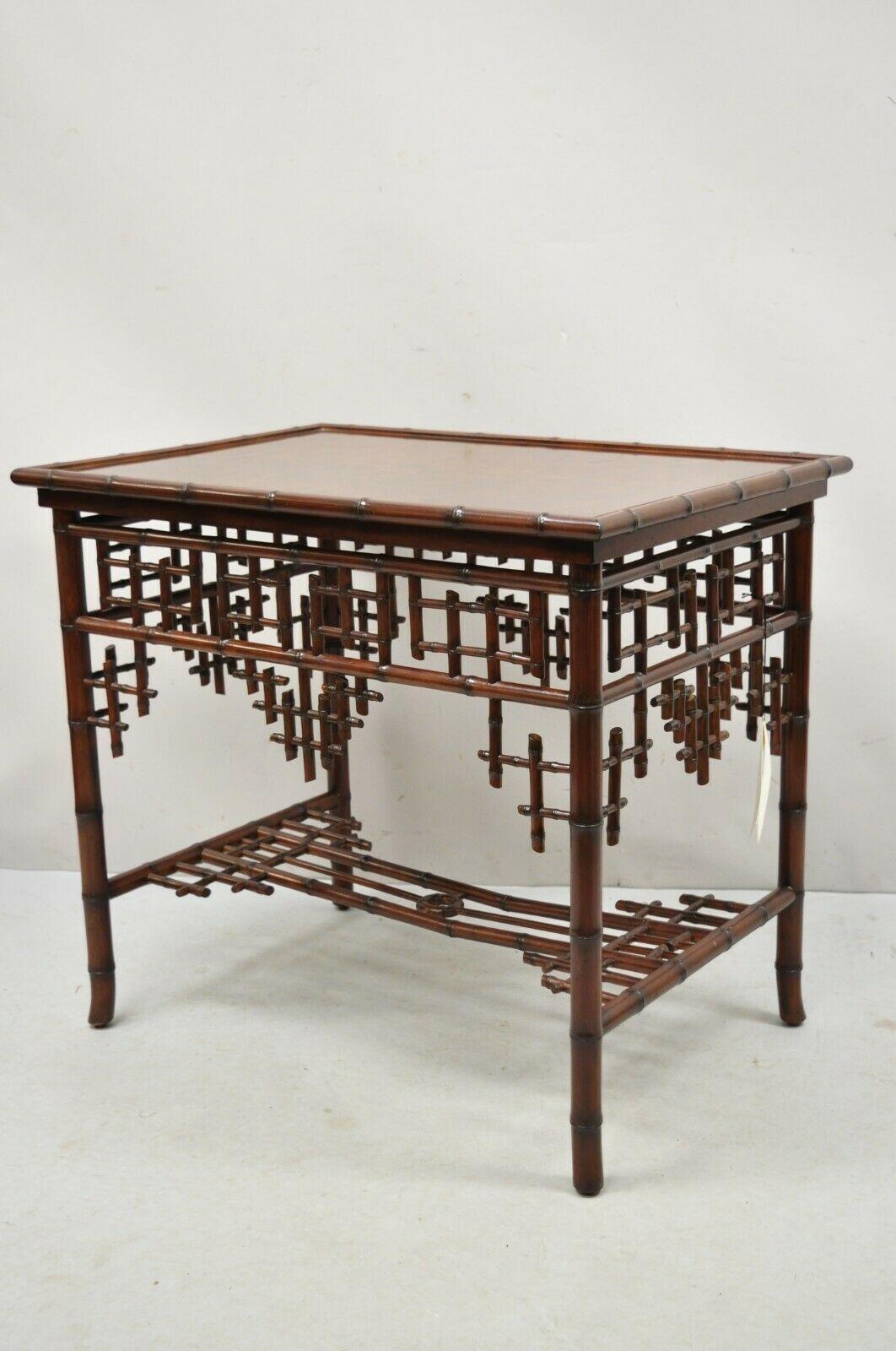Item: Ralph Lauren Home Indian cove lodge fretwork faux bamboo chinoiseries side table. Item features ornate faux bamboo fretwork skirt and stretcher, solid wood frame, beautiful wood grain, original labels, very nice item, great style and form,