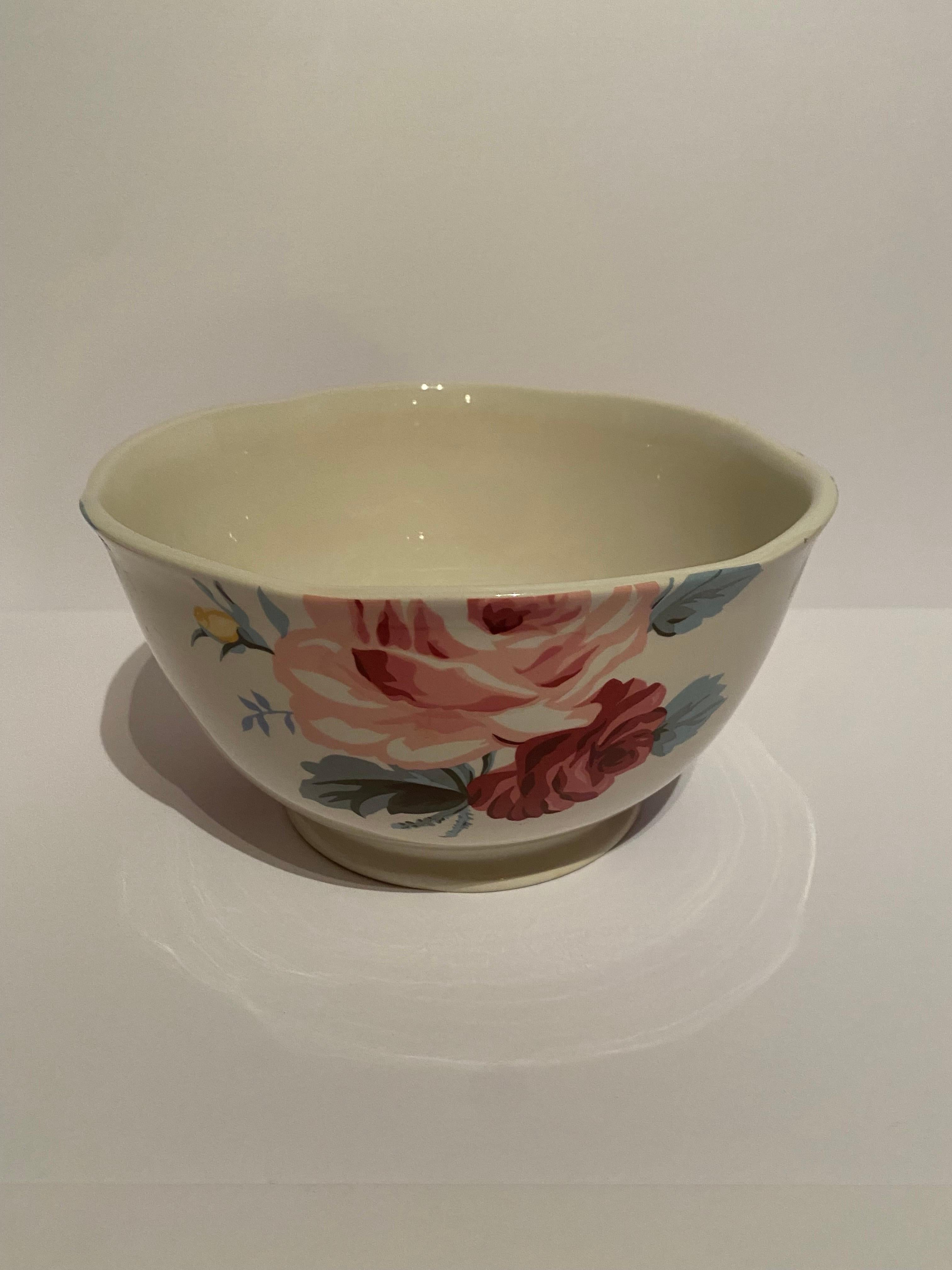 A footed centerpiece or serving bowl in the Kirsty pattern by Ralph Lauren Home.

Features a pastel floral pattern on white.

Crafted In Portugal. Discontinued pattern; made from 1999 to 2001.

Dimensions: 9” W x 7.5” H.
