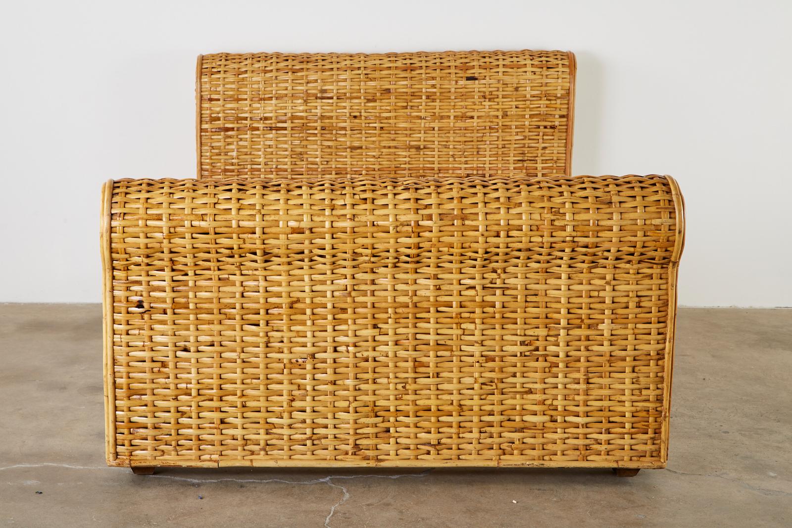 Organic modern style woven bamboo rattan bed by Ralph Lauren Home Polo collection. The large bed features a subtle sleigh form on each end of the frame. Very heavy and solid with makers plaque on the headboard. From an estate in Malibu, CA.