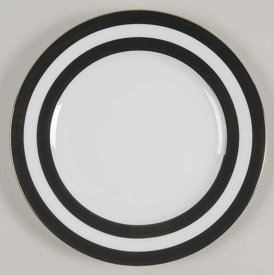 A set of 8 (eight) place settings in the Spectator black pattern by Ralph Lauren Home Collection. Porcelain. 

Signed, circa 1995-1996. This pattern is currently out of production. 

White with black wide stripe border and silver trim.

A total of