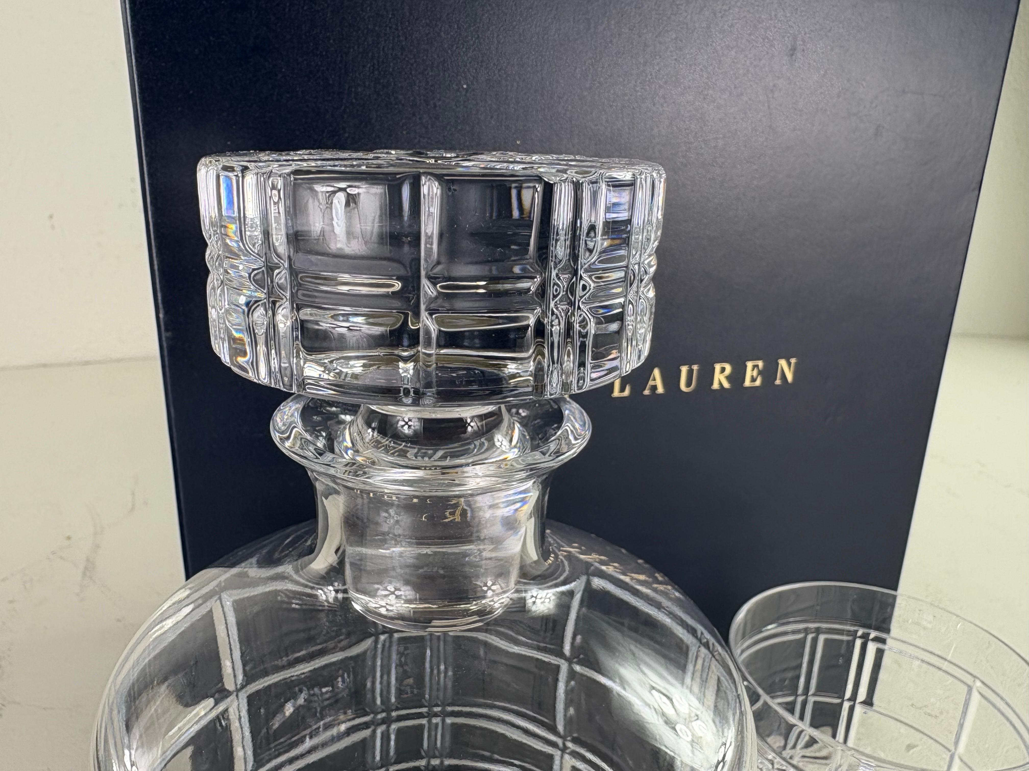 This is the Ralph Lauren cut crystal decanter gift box. This decanter set is the Hudson Plaid cut Crystal pattern. Includes the decanter, stopper and two glasses and presented in the blue box with the Ralph Lauren label on the top. Please note, the