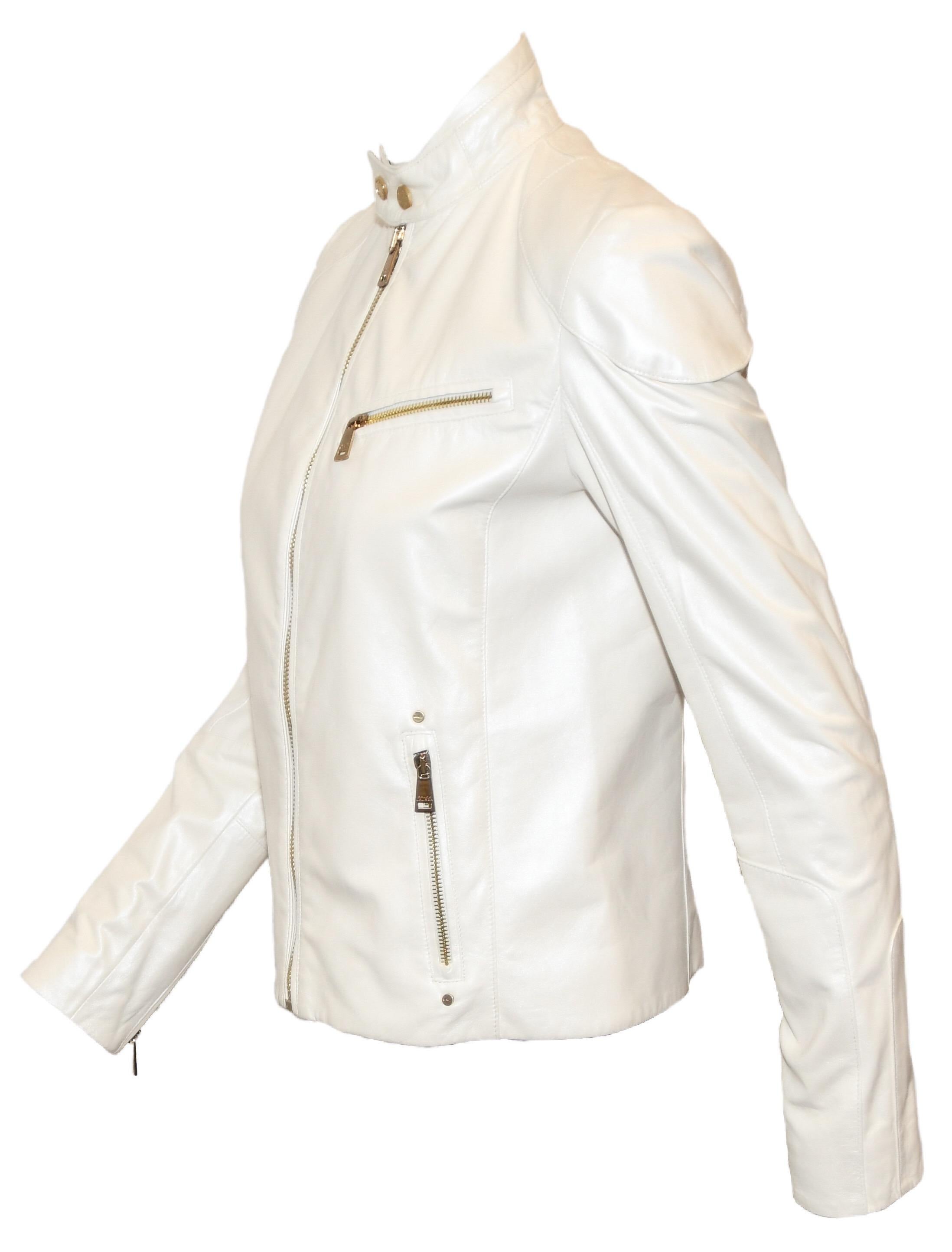 Ralph Lauren ivory iridescent leather biker/ bomber style jacket is detailed with gold tone zippers all over.  With 2 side zippered side pockets, 1 zippered chest pocket, a zipper of each cuff and a zipper at front for closure.  Jackets contains an
