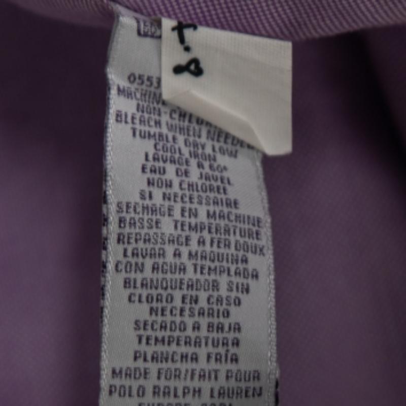 This shirt from Ralph Lauren will complete your formal attire with perfection. It is stitched using lavender cotton fabric, with an embroidered logo adorning the front. It is highlighted with long sleeves and button-down closure.