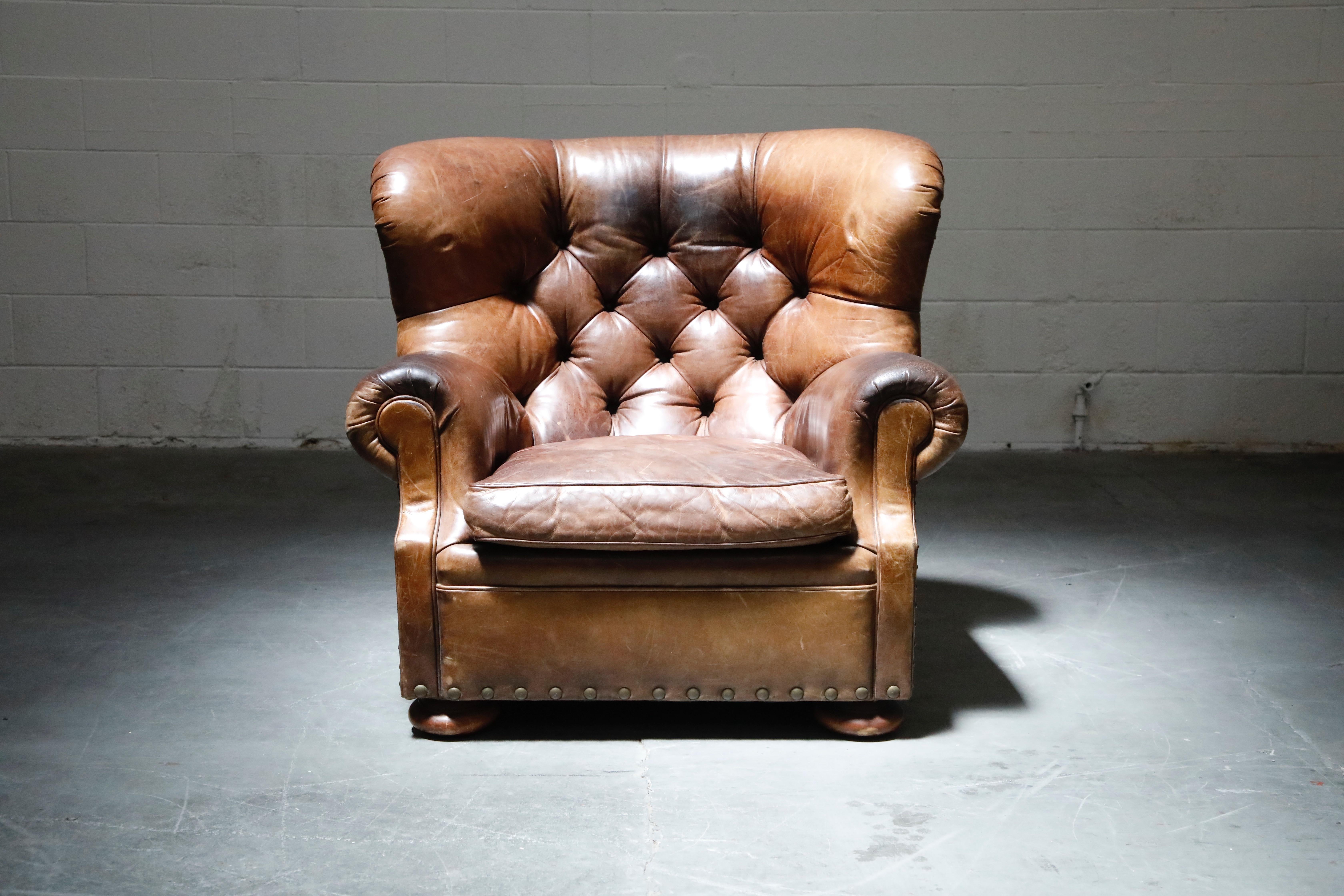 This Ralph Lauren labelled 'Writers' wingback club chair has such incredible lightly distressed and moderately patinated leather, very thick and quality natural hides were used in it's making. The striking large scale wingback silhouette is iconic,