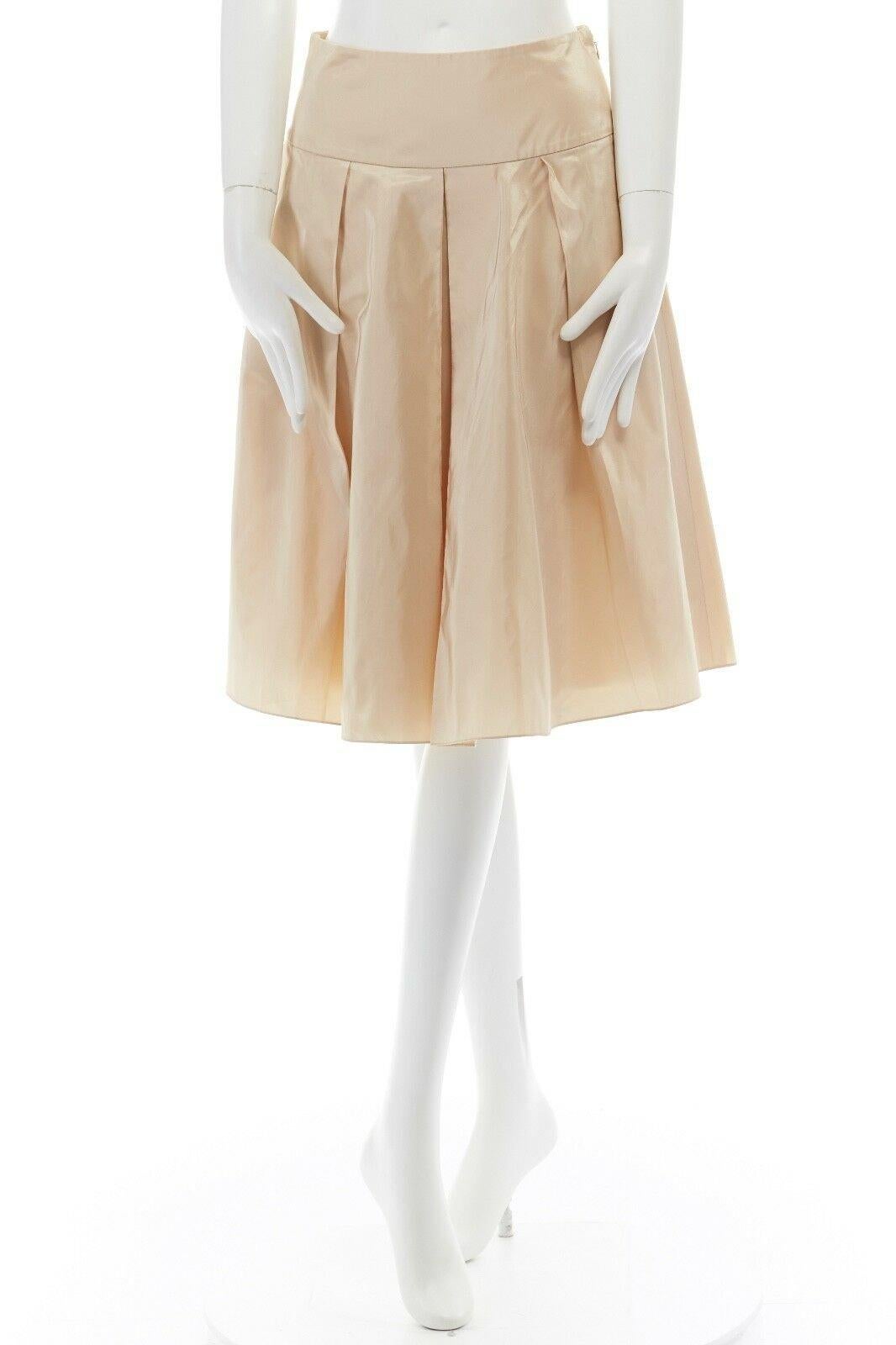 RALPH LAUREN light gold polyester silk blend pleated flared cocktail skirt US2 S 
Reference: LNKO/A00709 
Brand: Ralph Lauren 
Material: Polyester 
Color: Gold 
Pattern: Solid 
Closure: Zip 
Extra Detail: Polyester, silk. Light champagne gold. Flat