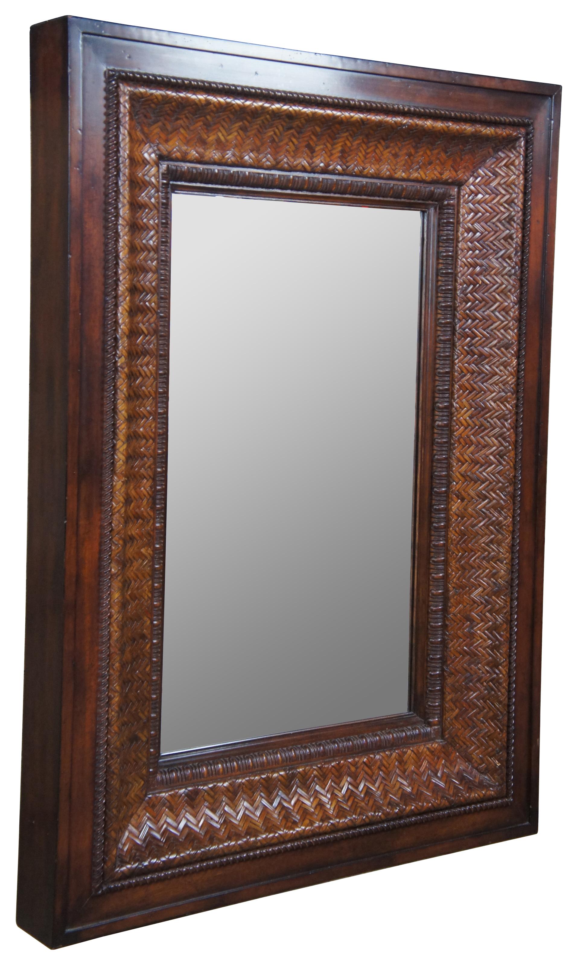 Traditional inspired Ralph Lauren mirror. A nice chunky mahogany frame with bevelled rattan leading to gadrooning trim. Perfect for use over a mantel or along any wall. Capable of being hung horizontal or upright. Brass Label along backside. 
  