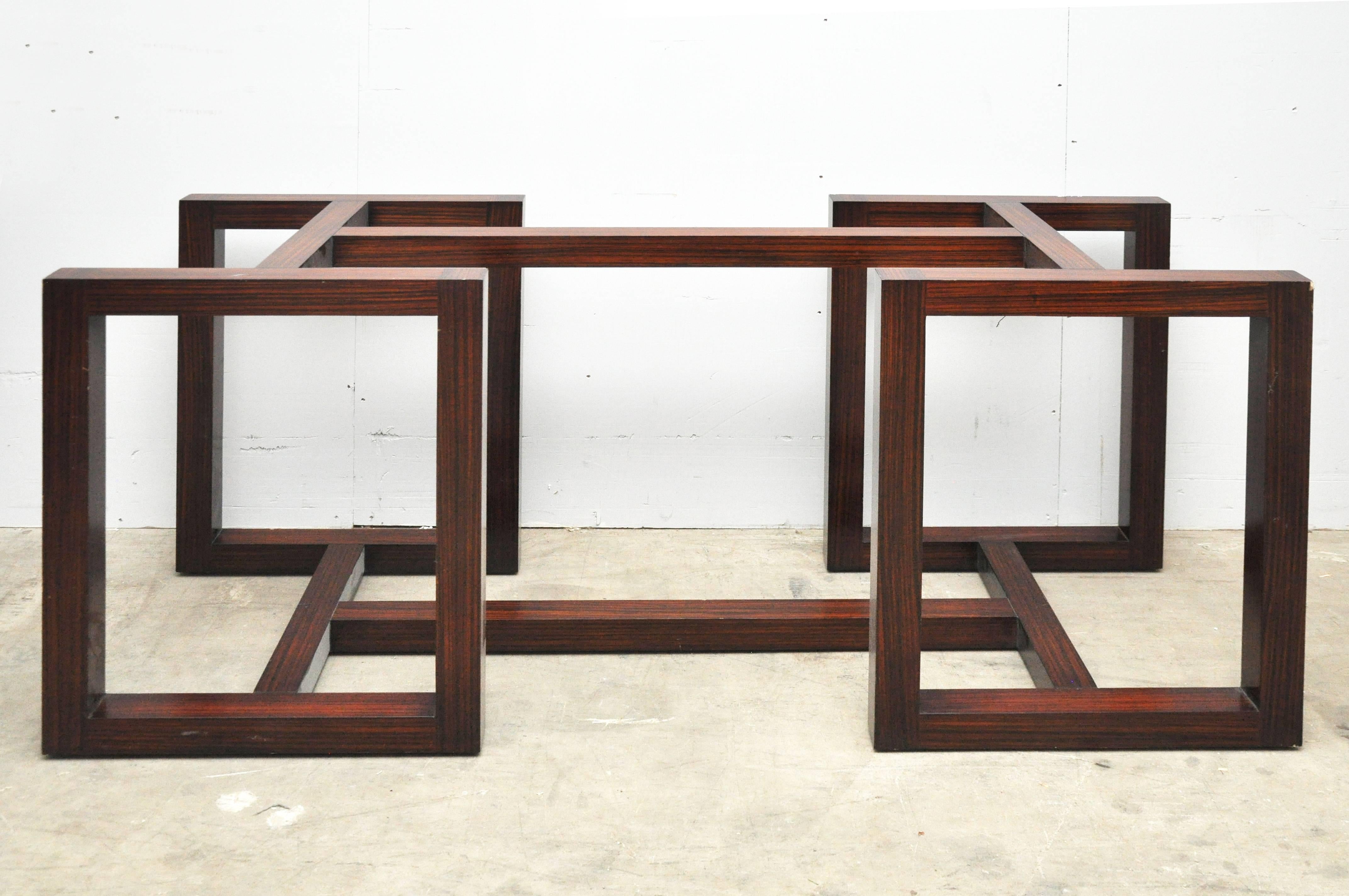 Classic modern, Minimalist-style dining table. a polished rosewood veneer base that is comprised of a series of interlocking rectangles. Brass Polo/Ralph Lauren label on the underside. Adjustable tap feet for easy leveling. 

Measures: The base is