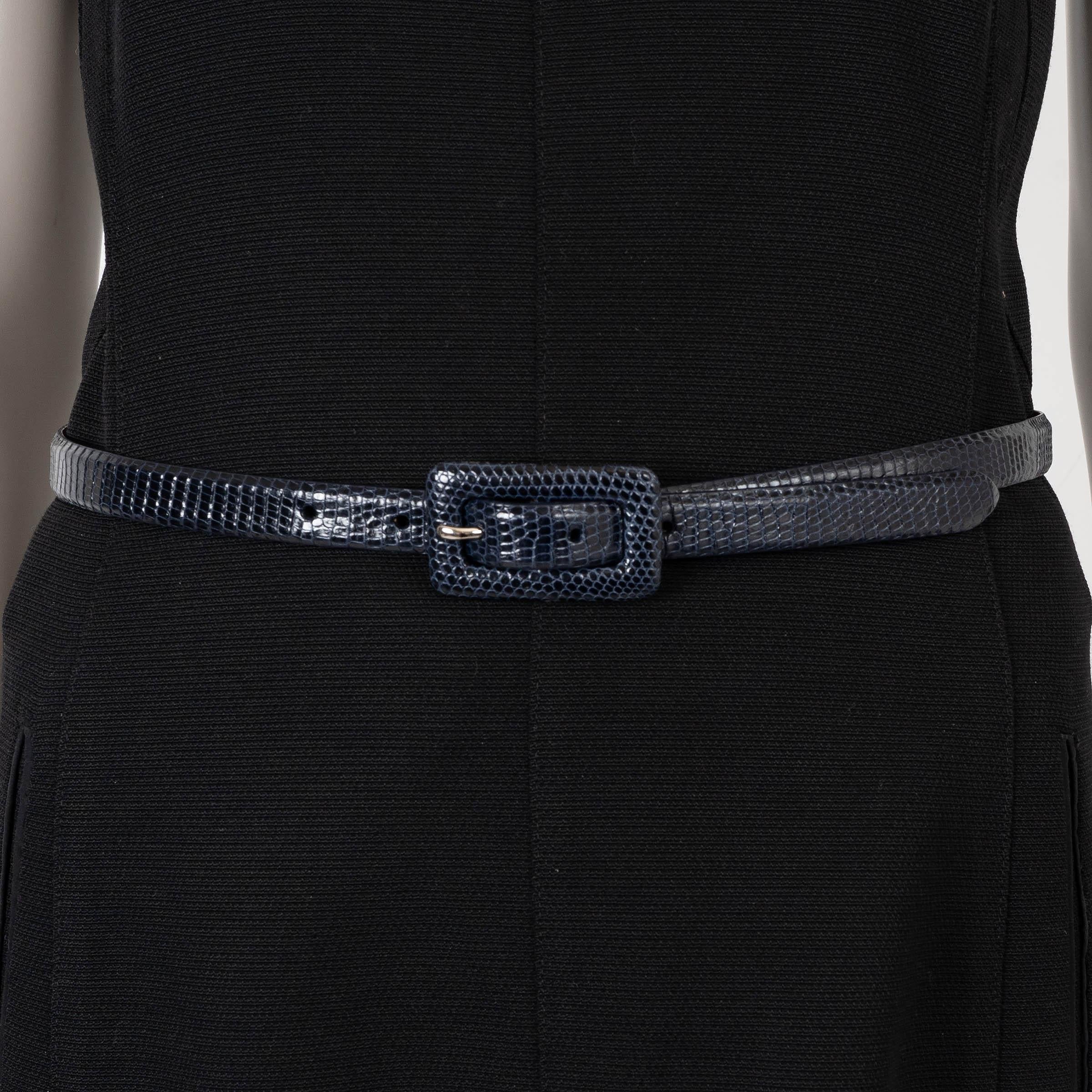 This 100% authentic Ralph Lauren skinny belt is crafted from exquisite midnight blue lizard leather, offering a sleek and sophisticated accessory for refined styling. Exceptionally versatile, it's perfect for cinching tailored trousers, denim, or