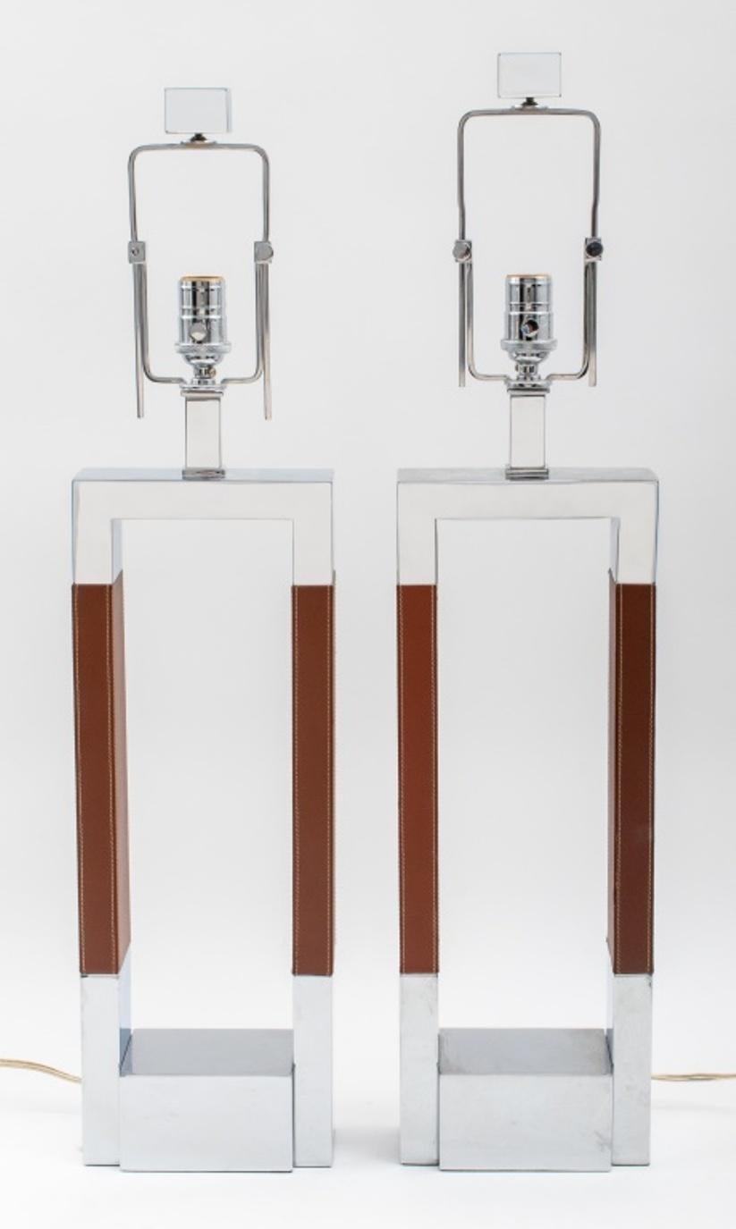 Ralph Lauren pair of modern table lamps in chromed metal with saddle stitched leather elements on the risers, marked on the back. 32