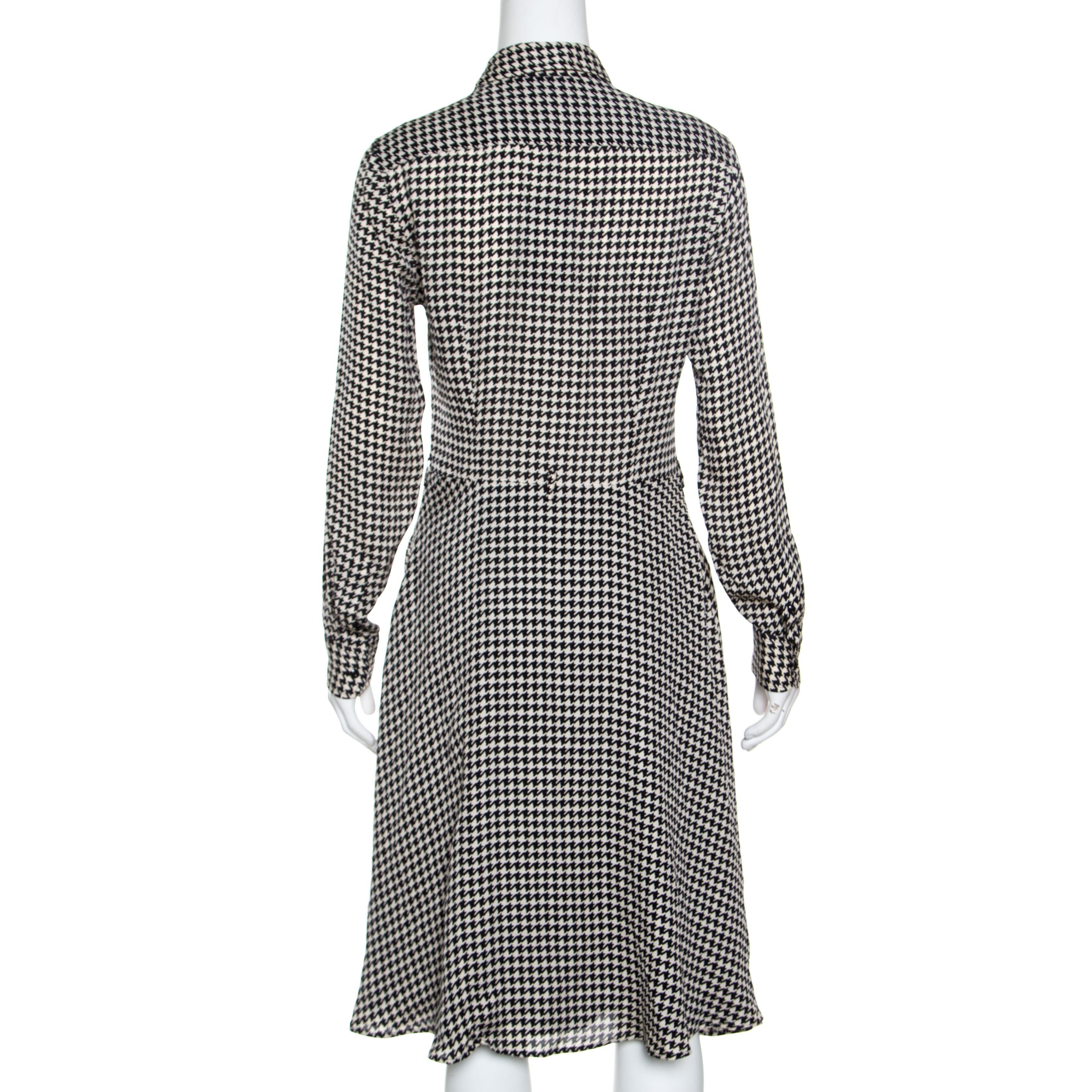 Bridging the gap between formal and casual, this Austin shirt dress from Ralph Lauren is a smart choice for work dos along with being a calm option for weekends. Featuring a monochrome houndstooth pattern throughout and a flouncy bottom, this one is