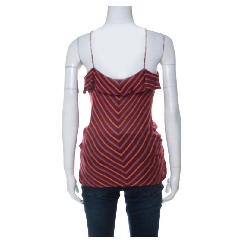 What a delighting sight this top brings! This Ralph Lauren creation flaunts noodle straps and stripes all over. The top will give you a beautiful look when you wear it with structured pants and slingback sandals.
