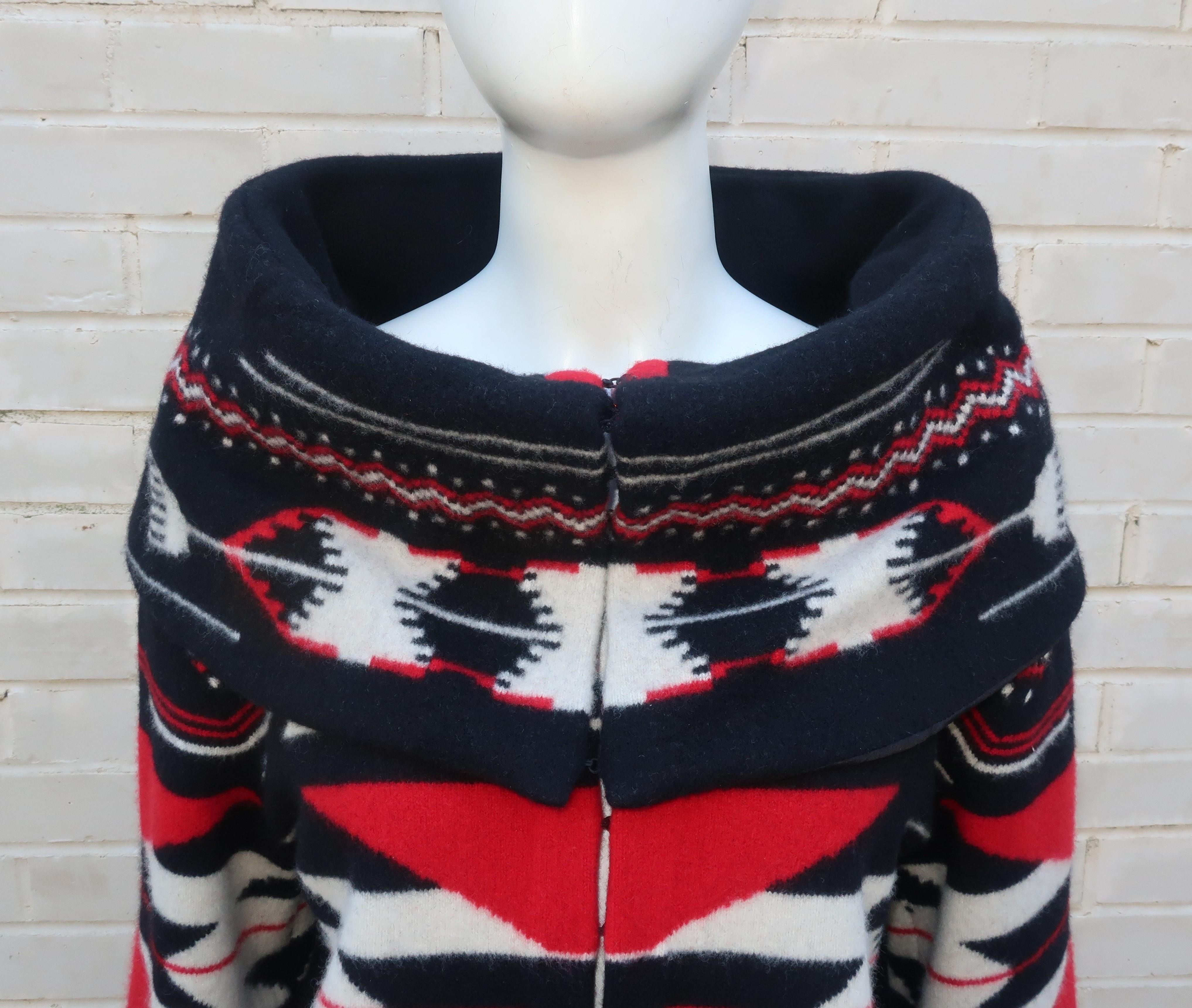 Wrap yourself in Ralph Lauren's cashmere blend sweater inspired by Native American blanket patterns in shades of red, black and white.  The sweater hooks at the front with a dramatic portrait style collar and modified bell sleeves.  The thick wool