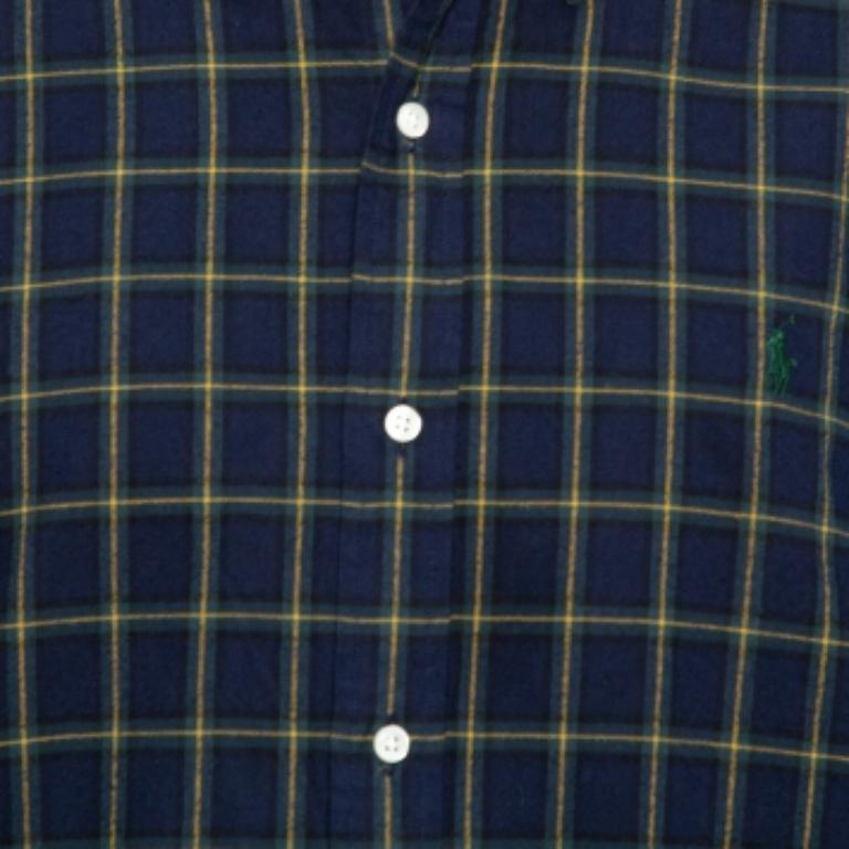 If you're wondering what to wear to work, this Ralph Lauren cotton shirt is here to save the day. The shirt, styled with a collar, plaided print, and lined with front buttons, is comfortable and stylish. A pair of contrasting trousers and oxfords
