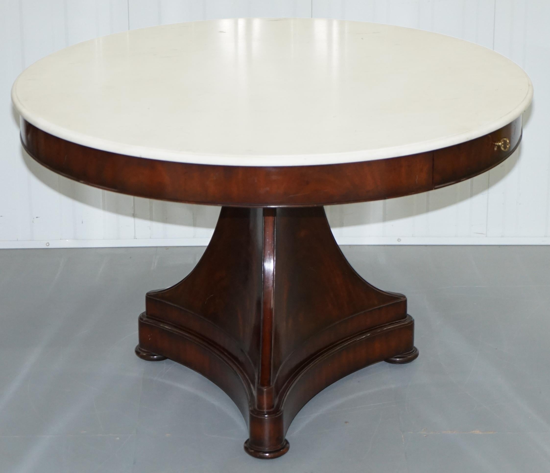 We are delighted to this absolutely stunning RRP £12,000 Ralph Lauren centre occasional American mahogany pedestal table with solid marble top

A truly exquisite piece, the flamed mahogany looks glorious in the right light, the Carrara marble top