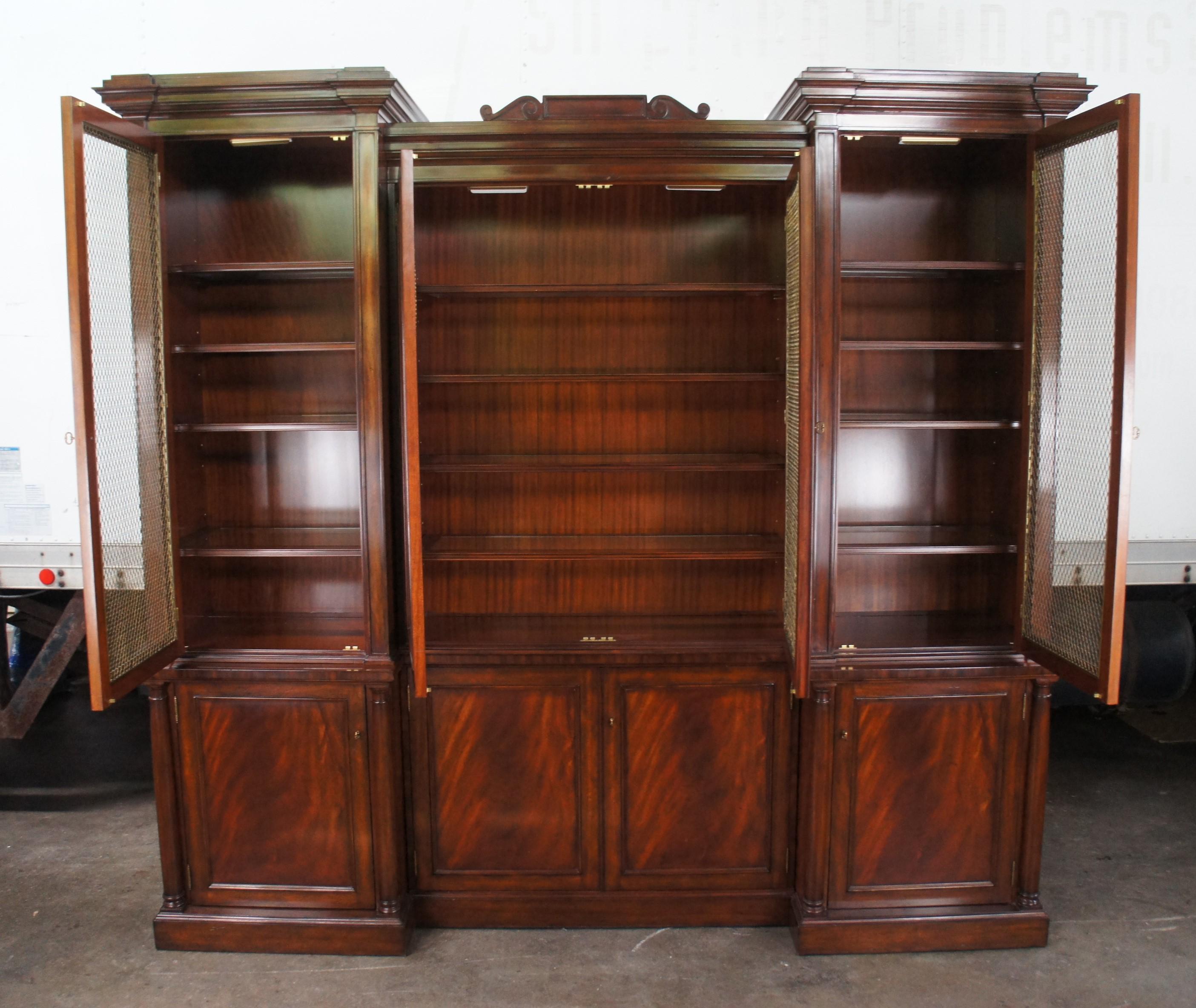 Ralph Laurens Noble Estate Bunching China 1840-22 , circa last quarter 20th century.  An exceptional display cabinet drawing inspiration from English Georgian and Chippendale styling.  Made from mahogany with two outer cabinets that break forward