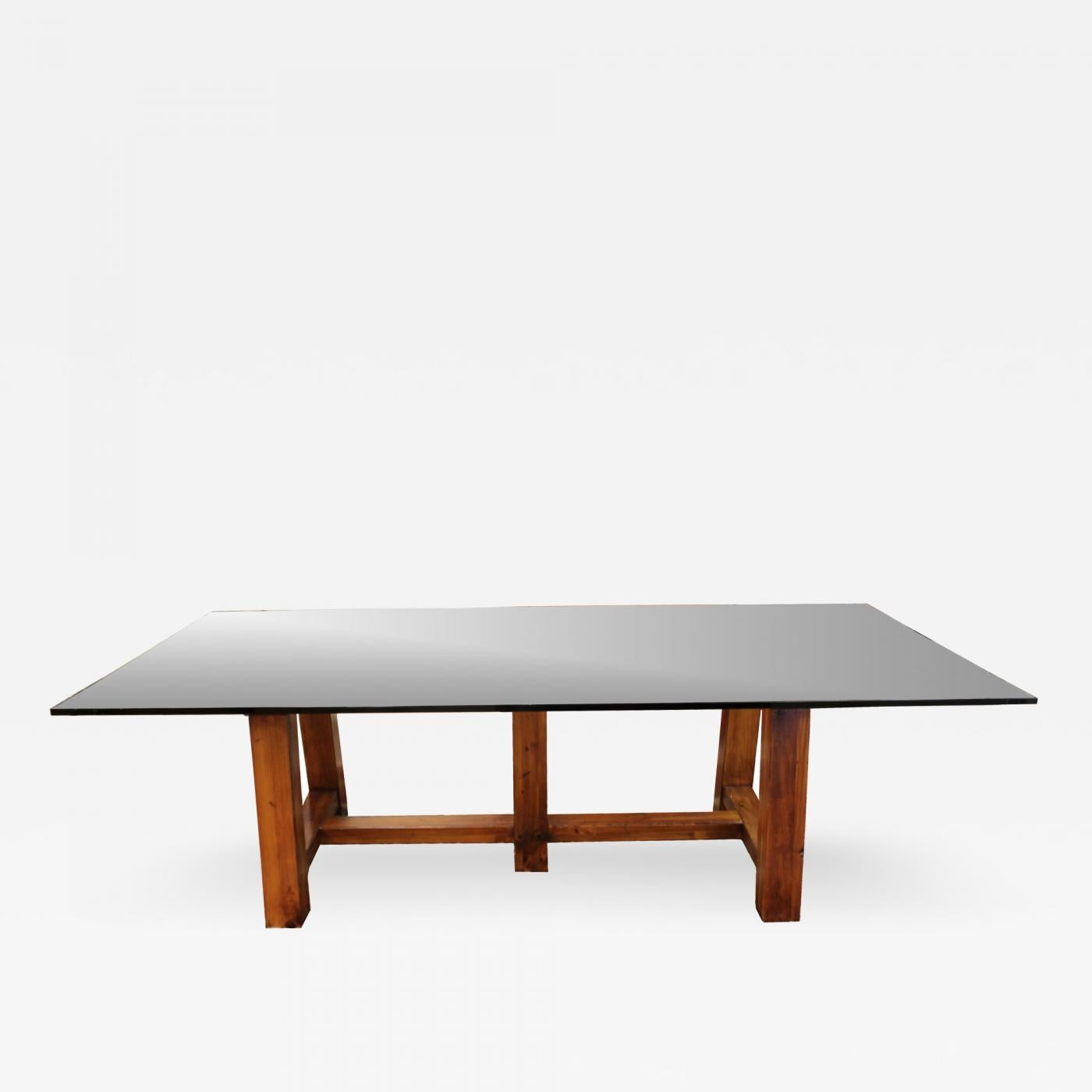 The North Atlantic Coast dining table by Ralph Lauren Home. USA, 1990-2000.

Features a rough-hewn natural pine wood trestle base with a rectangular clear glass top.

Dimensions of glass top: 100 inches L x 50 inches D x 30 inches H.