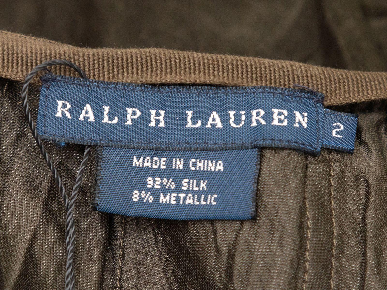 Product Details: Olive silk maxi skirt by Ralph Lauren. Pleating throughout. Zip closure at side. 28