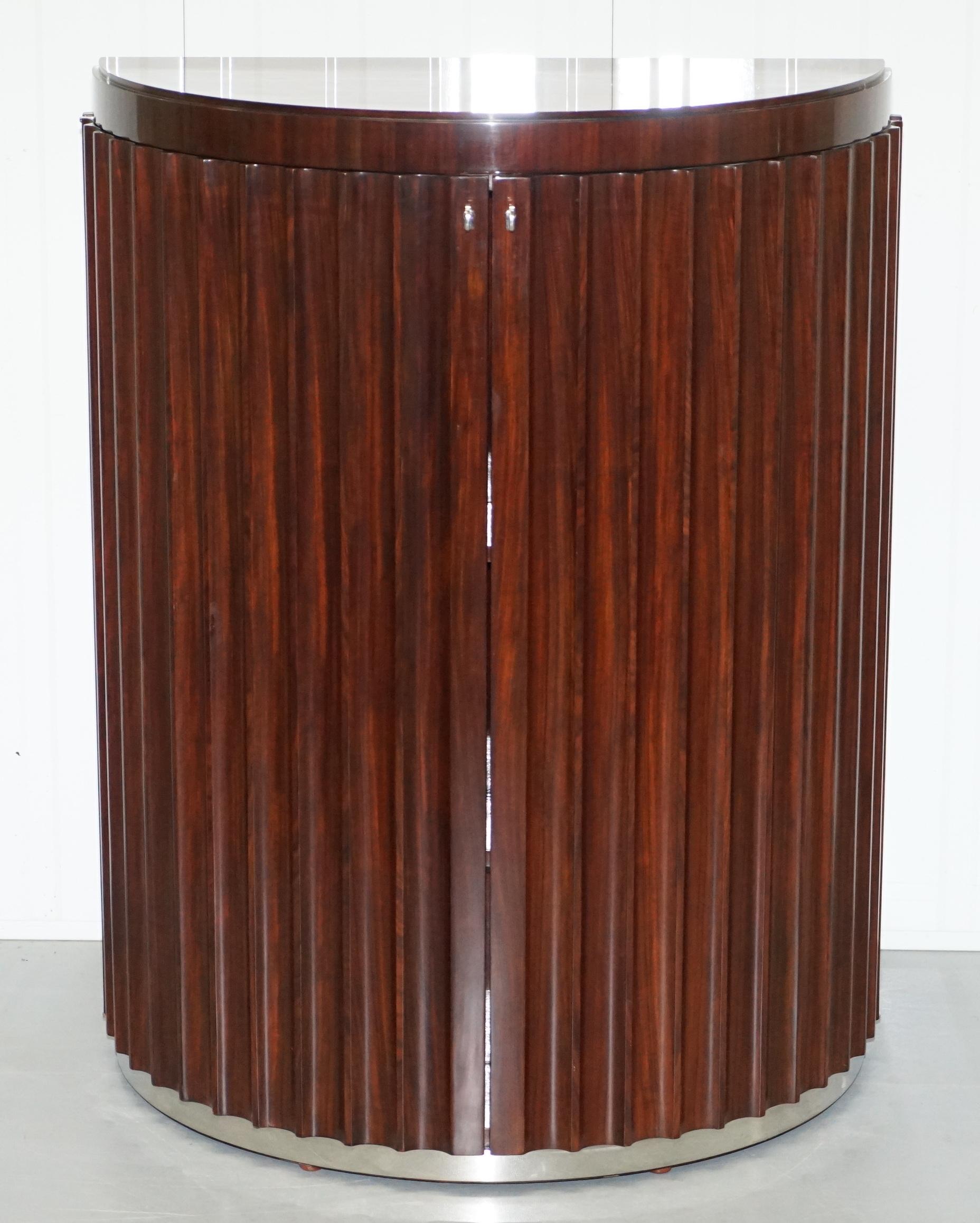 We are delighted to offer for sale this new ex-showroom stock Ralph Lauren RRP £10,500 penthouse fluted redwood bar cupboard which chrome fittings

I have recently taken into stock around 12 brand new showroom pieces from Ralph Lauren home, the