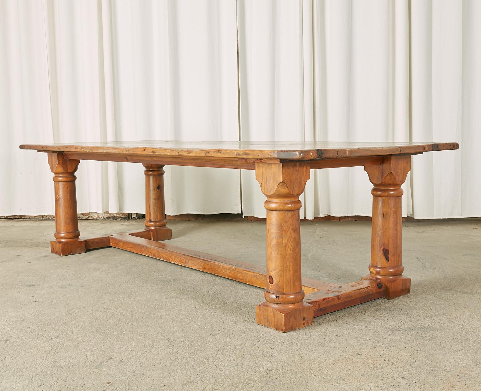 Grand country style pine farmhouse trestle dining or harvest table designed by Ralph Lauren. The large 