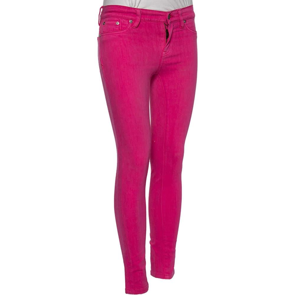 Ralph Laurens pink hued jeans are just what you need to add a pop of color to your wardrobe. Tailored from a cotton blend the jeans have a skinny fit belt loops external pockets and the label patch at the back. Style them with a light colored blouse