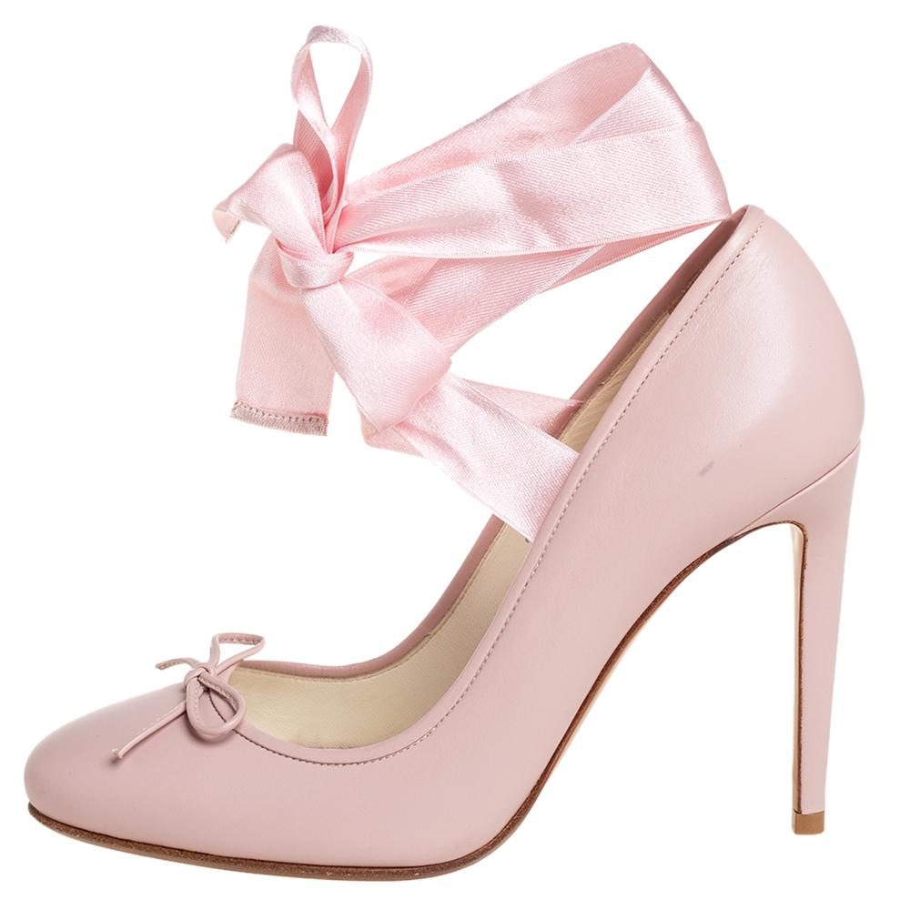 Walk with panache in these splendid pink pumps from Ralph Lauren Collection. They are crafted from leather and styled with bow-detailed round toes and beautiful ankle wraps. They come endowed with comfortable leather insoles and stand tall on 10 cm