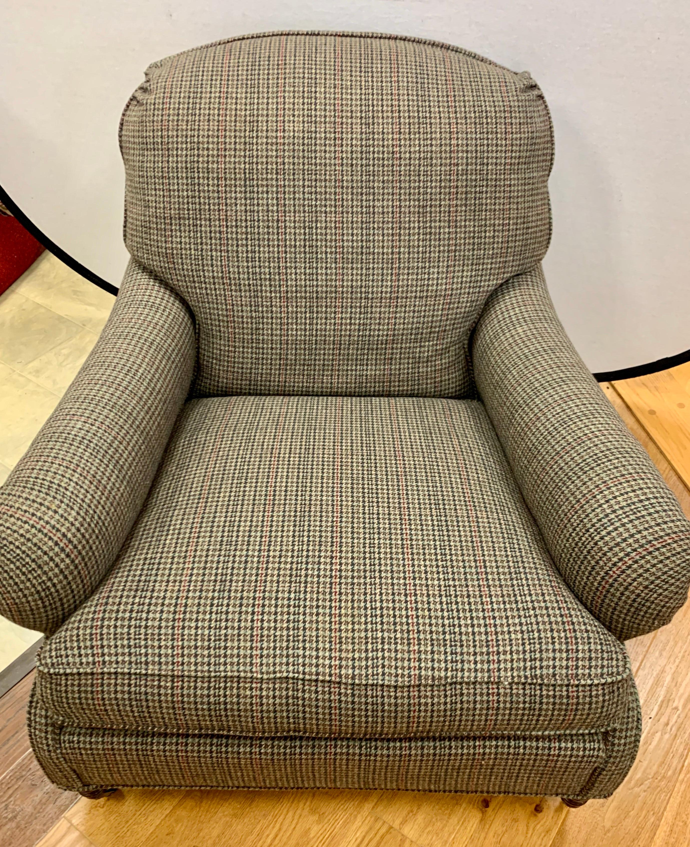 Vintage Ralph Lauren blue label reading chair on caster wheels. Classic RL brown tweed fabric which is original. Four caster wheels for ease of movement, circa 1980s. Features 8-way hand tied construction.
All RL hallmarks present.