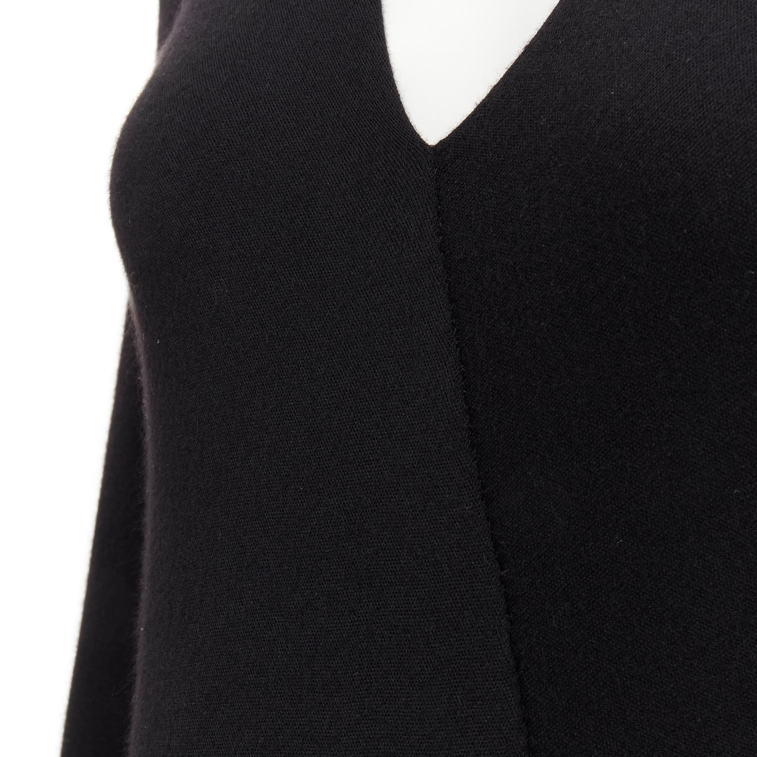 RALPH LAUREN Purple Collection 100% cashmere black wrap long sleeve body top XS 
Reference: LNKO/A01879 
Brand: Ralph Lauren 
Material: Cashmere 
Color: Black 
Pattern: Solid 
Extra Detail: Wrap front. Stretch button bodysuit. 
Made in: USA