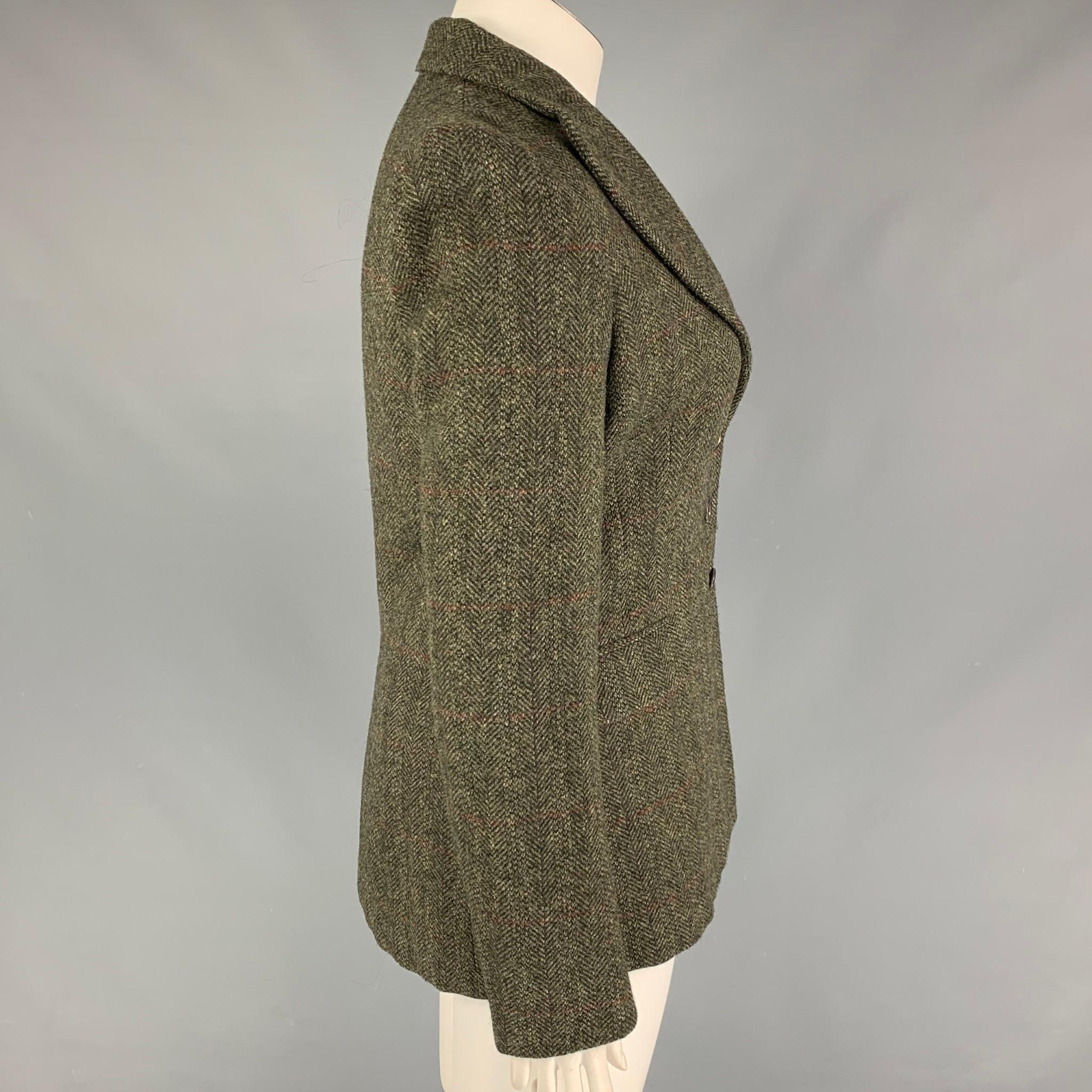 RALPH LAUREN 'Purple Label' jacket comes in a olive & brown herringbone wool with a full liner featuring a peak lapel, flap pockets, and a three button closure. Made in USA. 

Very Good Pre-Owned Condition.
Marked: 12

Measurements:

Shoulder: 16