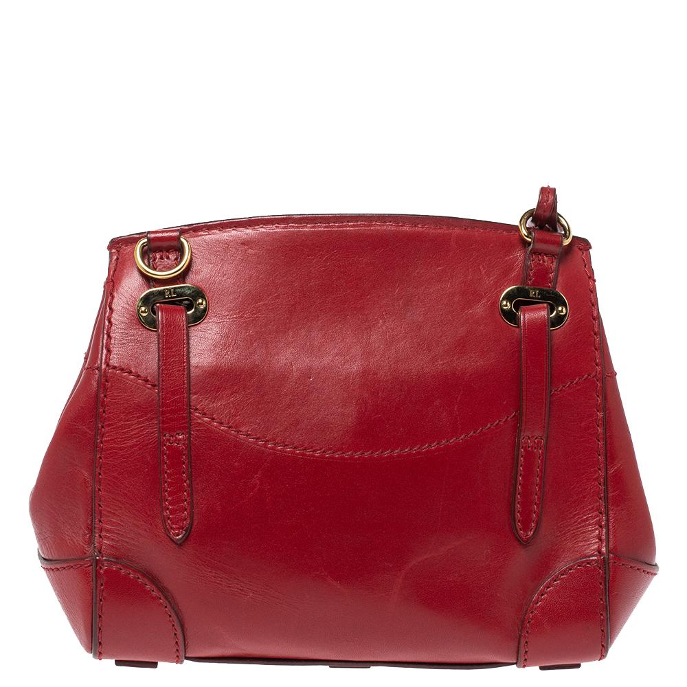 This Ralph Lauren Ricky bag is simply breathtaking. Meticulously crafted from leather, the bag delights not only with its appeal but structure as well. It is held by two top handles, detailed with gold-tone hardware and equipped with a well-lined