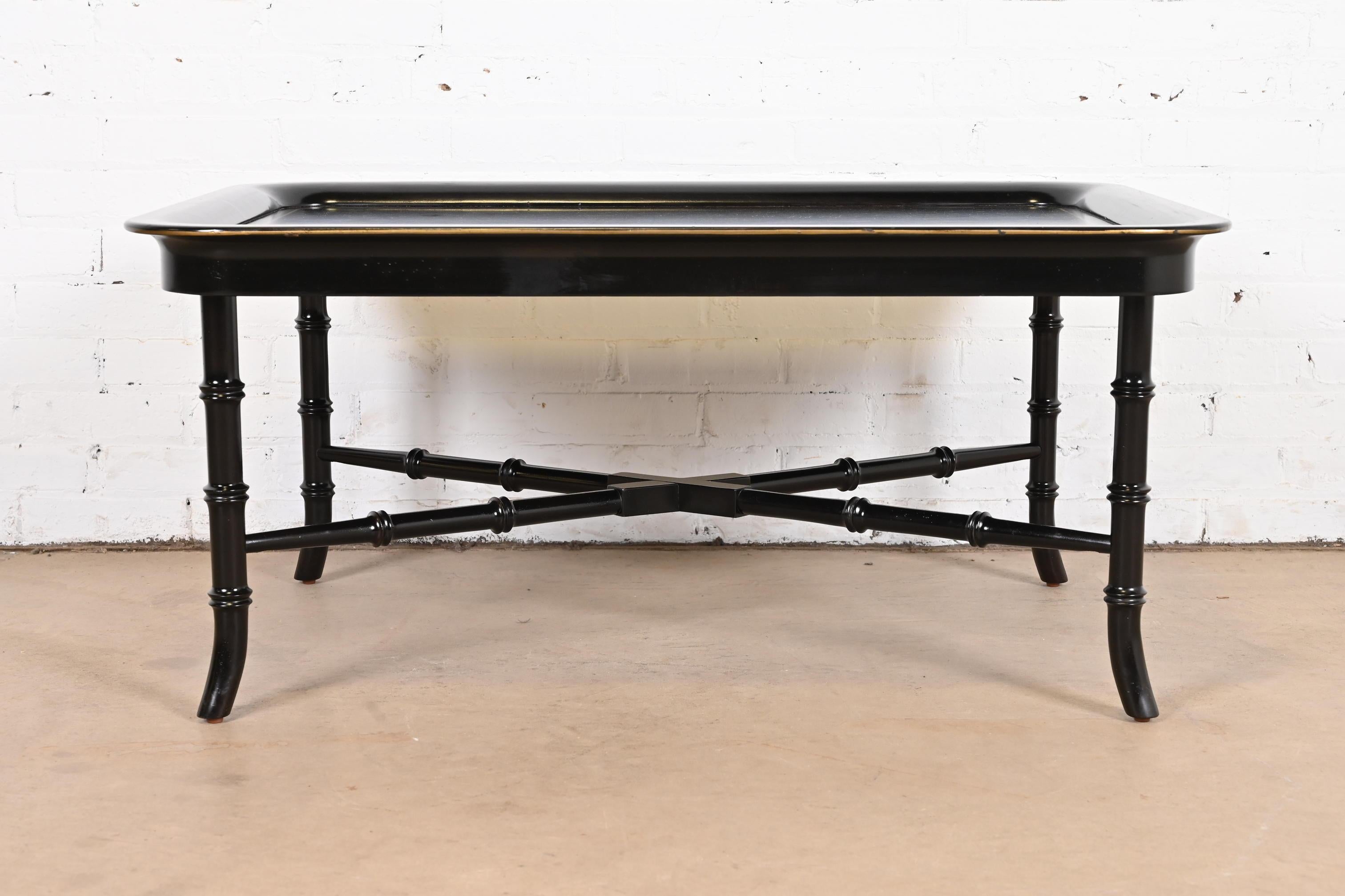 A gorgeous Regency style coffee or cocktail table

By Ralph Lauren

USA, Late 20th century

Black lacquered wood, with gold gilt painted details, and bamboo form legs and stretchers.

Measures: 40