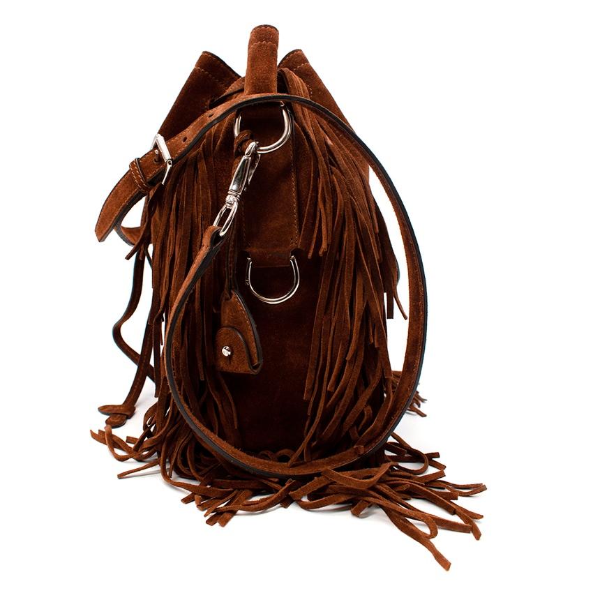 Ralph Lauren Ricky Brown Fringed Suede Bucket Bag
 

 - Rich nut brown suede drawstring bucket, with fringing details 
 -Adjustable and removable shoulder strap 
 -The interior features multiple pockets
 -Silver-tone hardware
 

 Materials 
 100%