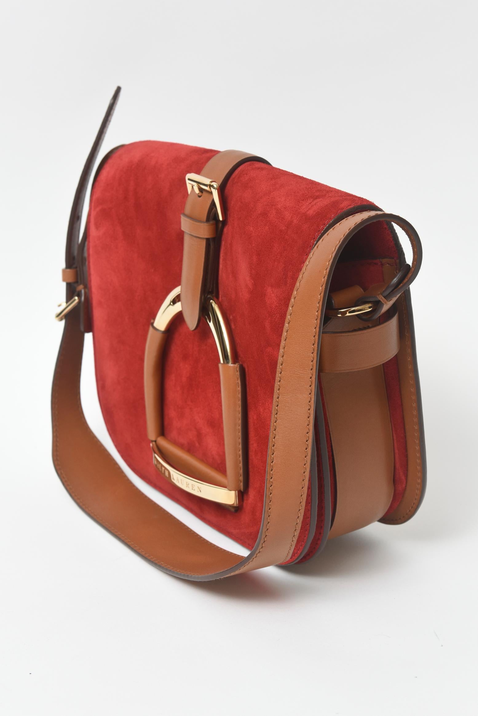 Hard to Find Red Suede Stirrup Bag from
Ralph Lauren's
The Equestrian Collection Shoulder Bag

This bag was seen on Ralph Lauren's runway.  The purse is a combination of rich red suede and luxurious brown calfskin.  The most notable thing about this