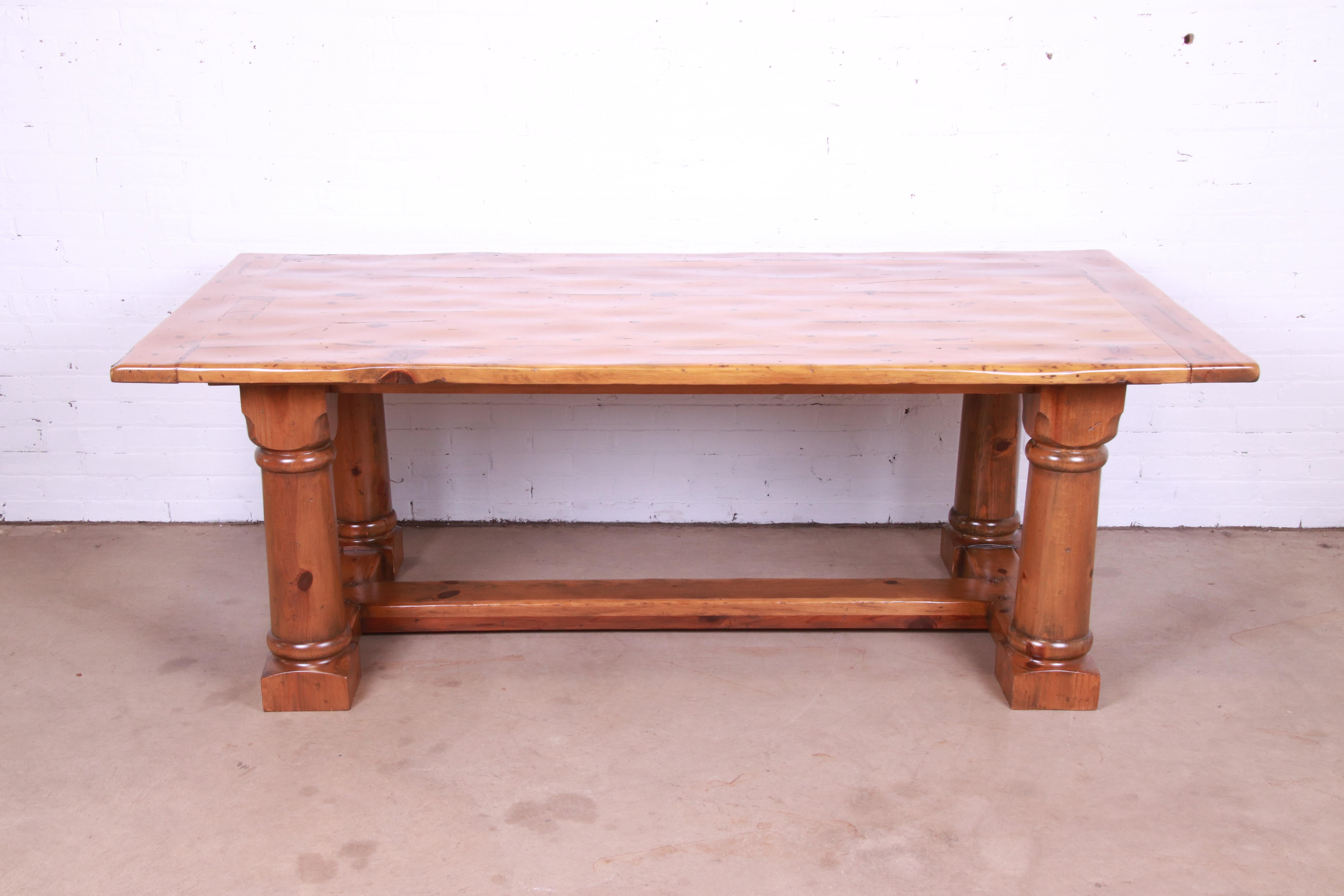 A gorgeous Rustic European style harvest farmhouse refectory dining table

By Ralph Lauren

USA, late 20th century

Solid pine, with turned legs and trestle style base. Intentionally distressed for a rustic look.

Measures: 84