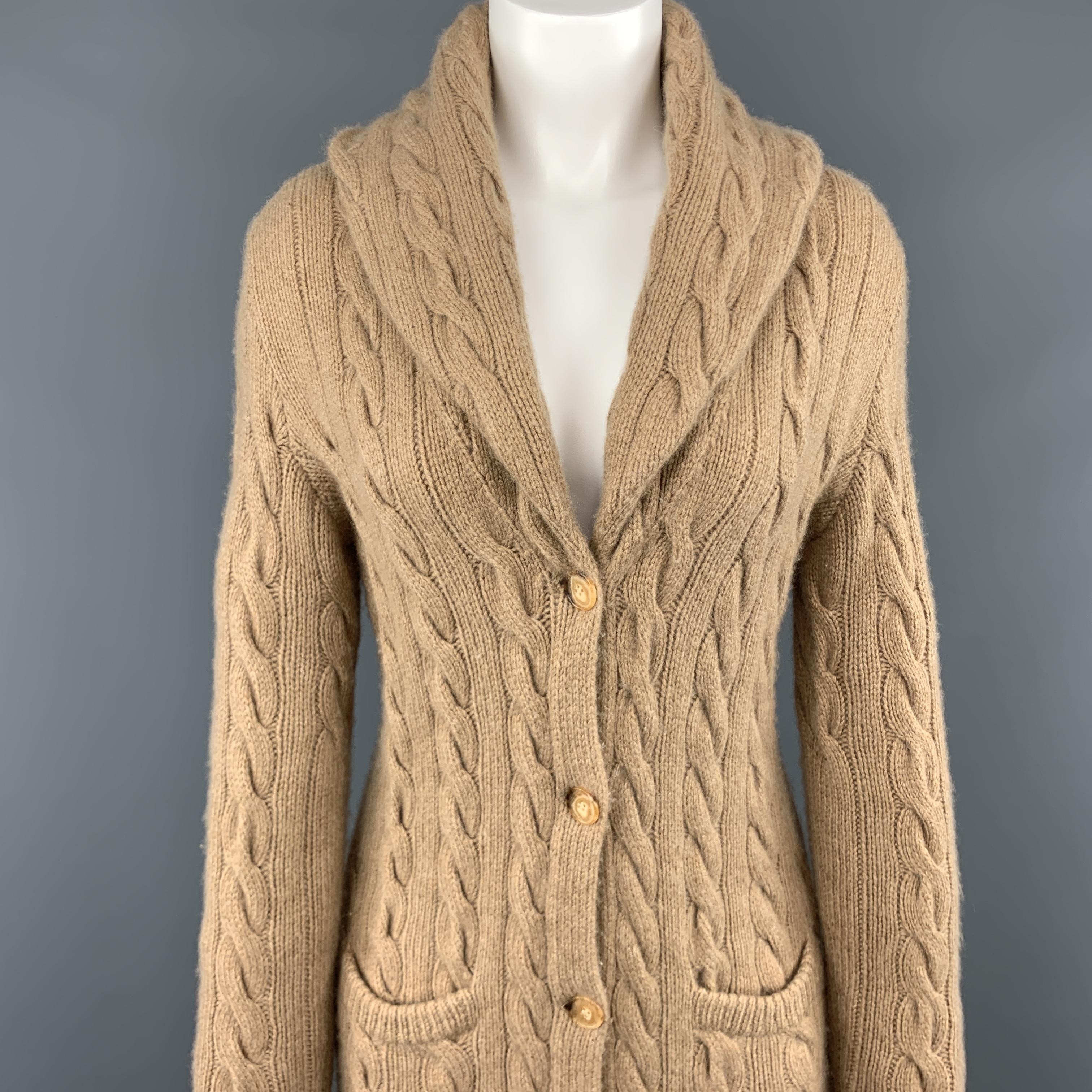 RALPH LAUREN BLACK LABEL log line cardigan comes in camel beige hand cableknit cashmere with a shawl collar, pockets, and long sleeves. 

Excellent Pre-Owned Condition.
Marked: S

Measurements:

Shoulder: 15 in.
Bust: 34 in.
Waist: 29 in.
Hip: 34