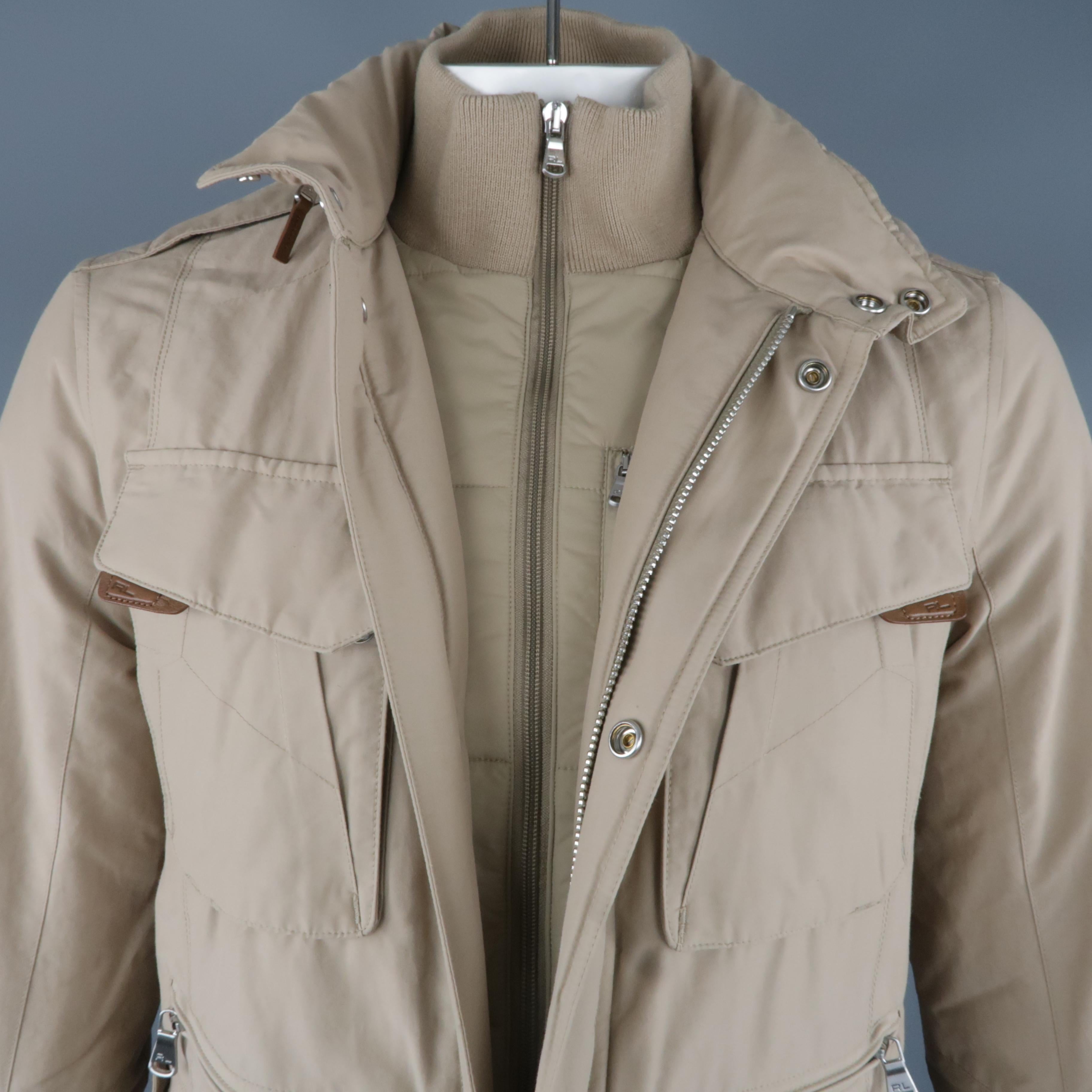 RALPH LAUREN jacket comes in a khaki nylon featuring a 3 in 1 design with a hidden hood detail, full zip closure, and front patch pockets.
 
Excellent Pre-Owned Condition.
Marked: S
 
Measurements:
 
Shoulder: 18.5 in.
Chest: 41 in.
Length: 28.5 in.