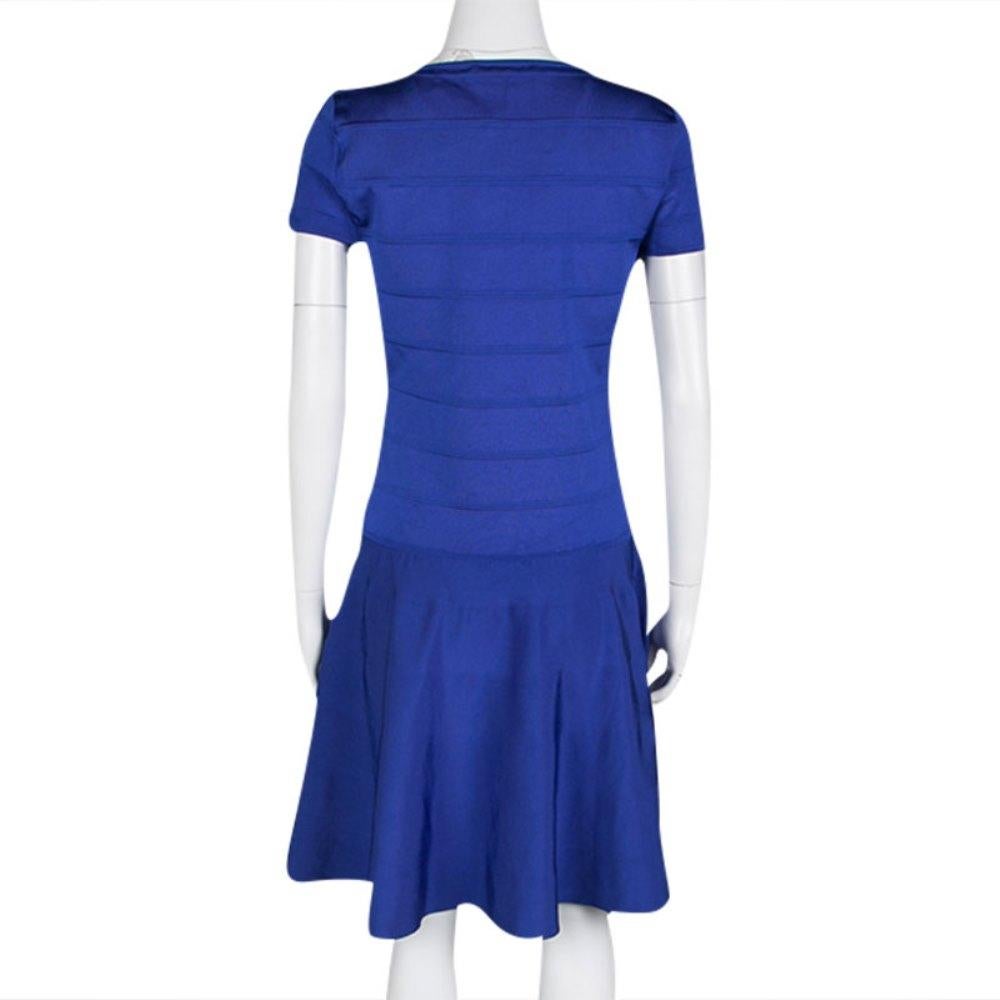 Ralph Lauren's Bandage dress is the epitome of wearable feminity. Designed in a true skater style, this blue outfit has a fitted, paneled bodice with fluid bottom featuring loose pleats. It has short structured sleeves and an impressive v-neckline.